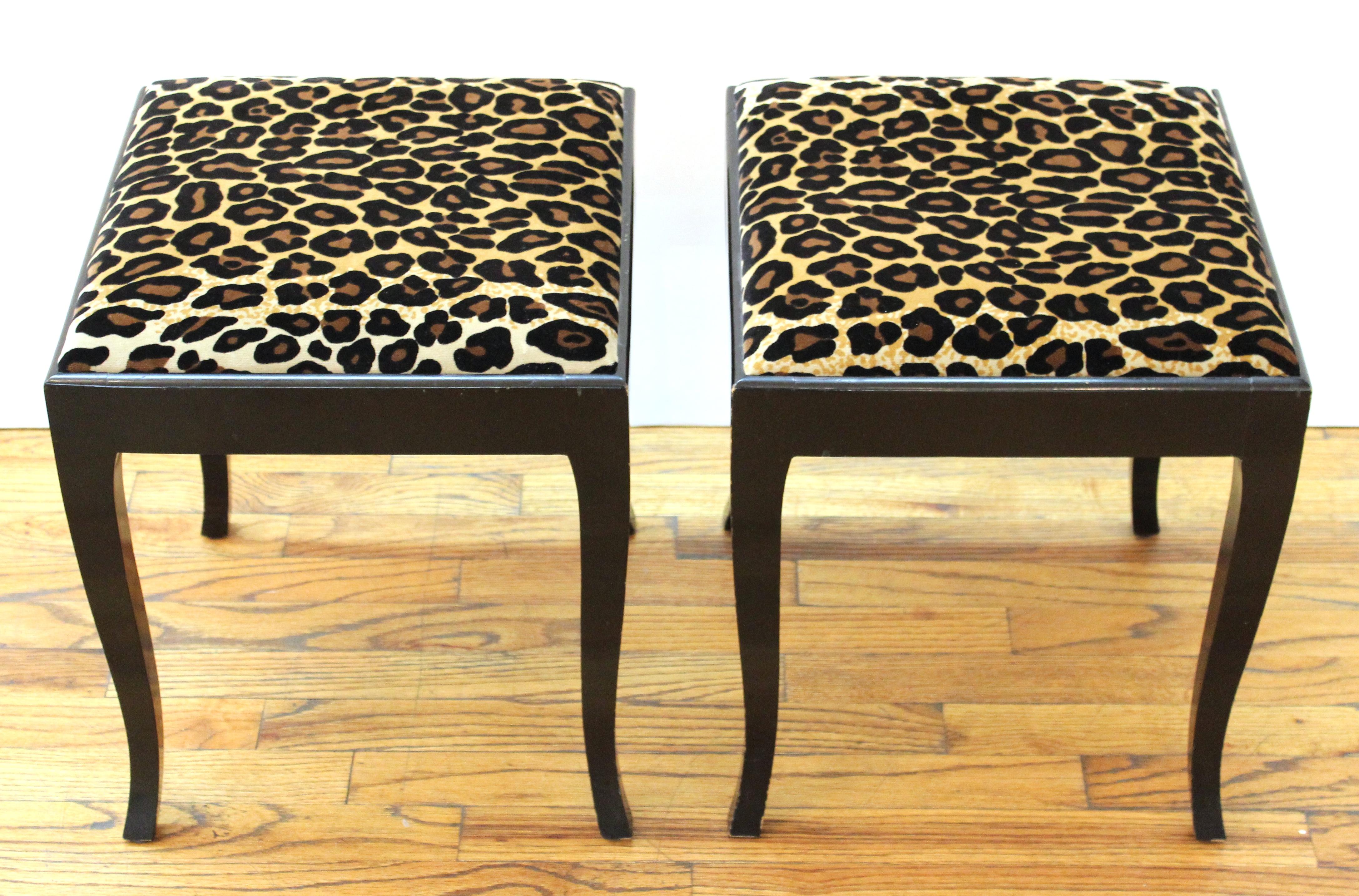 Swedish Art Deco style pair of square stools in ebonized wood with cabriole legs and leopard print upholstery, circa 1930.