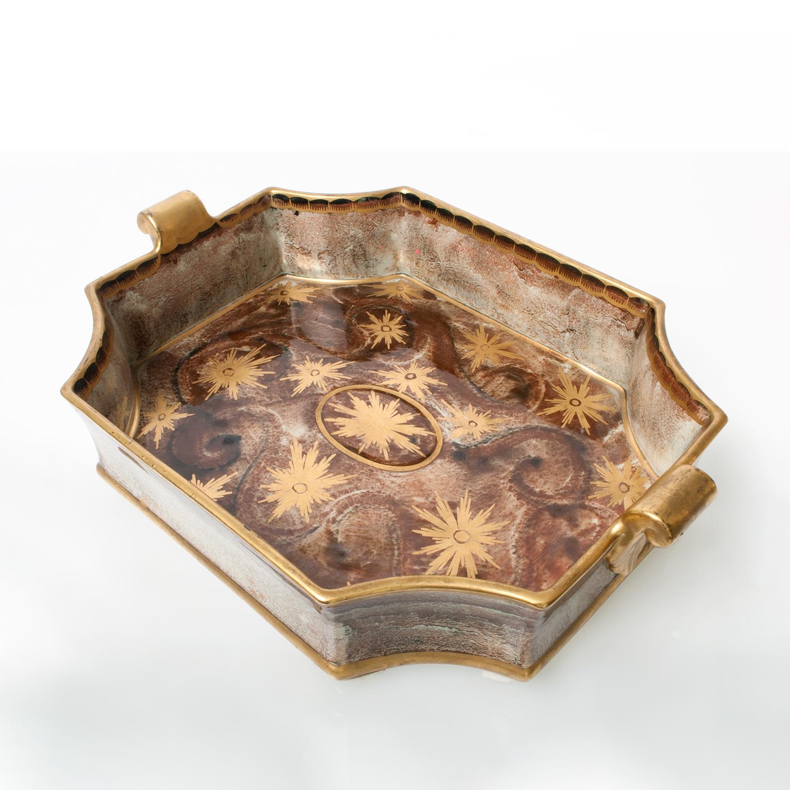 Large Swedish Art Deco tray or bowl with notched corners and handles. Hand decorated with gold glaze over a brown and green luster glaze. Designed by Josef Ekberg for Gustavsberg, signed and dated 1931.