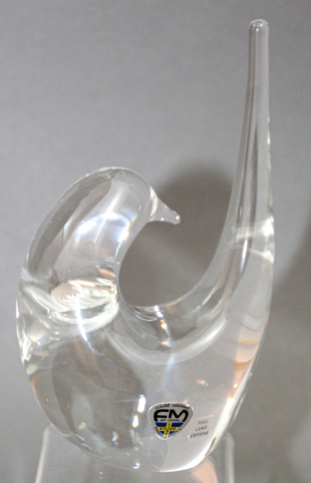 Scandinavian modern full lead crystal bird figure sculpture ornament was made by Fare Marcolin for FM Konstglas Crystal Bird of Ronneby Sweden circa 1970s.
Vintage Ronneby FM Konstglas Ronneby Sweden Studio Crystal Art Glass Bird