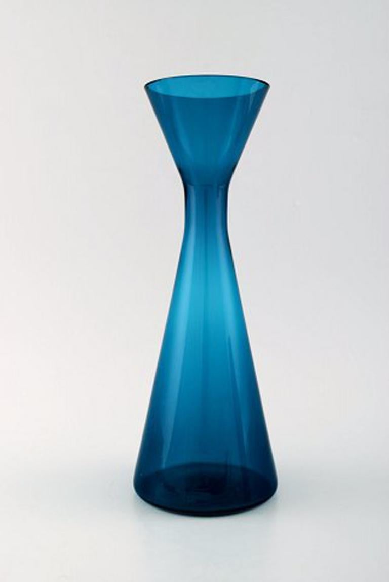 Swedish art glass, two handblown vases in blue, 1960s.
Measures: 24 cm x 9 cm. (largest)
In perfect condition.