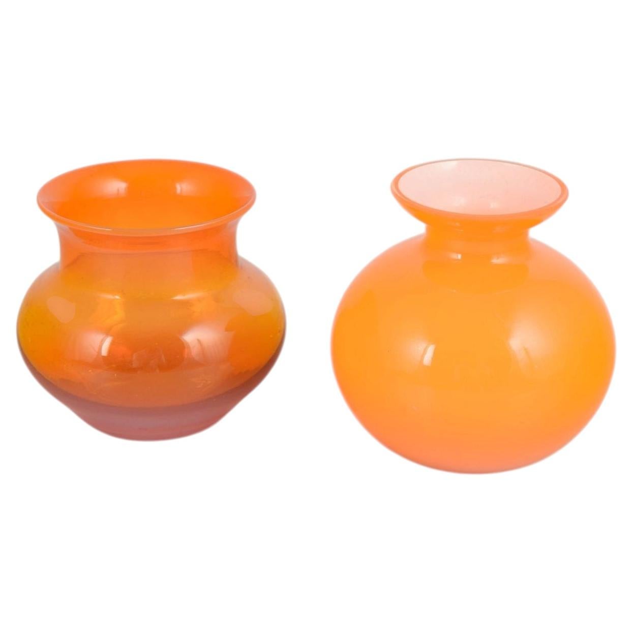 Swedish art glass. Two mouth-blown vases in vibrant orange glass. 1970s