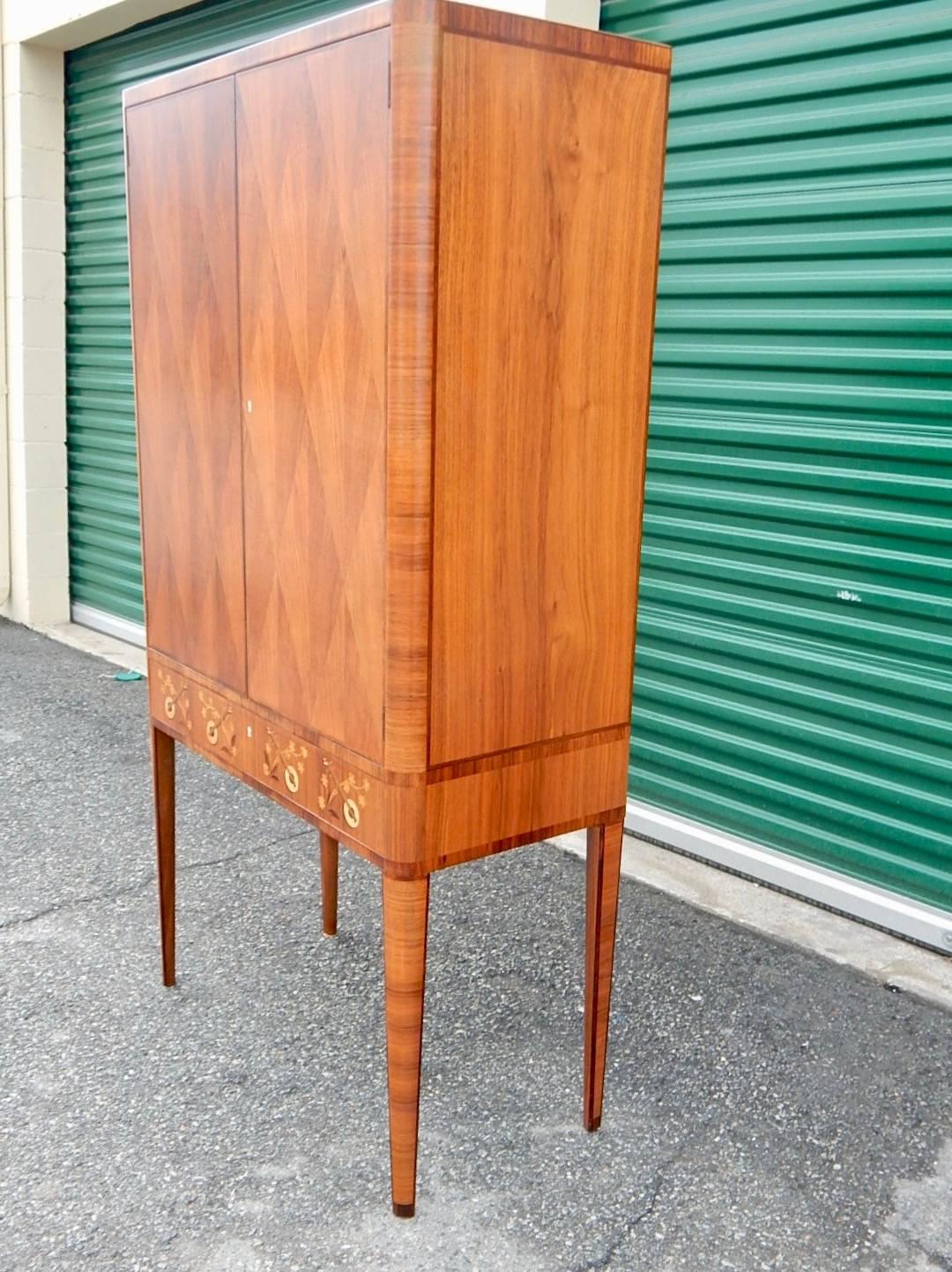 Walnut Swedish Art Moderne Storage Cabinet with Inlaid Musical Instruments, circa 1940