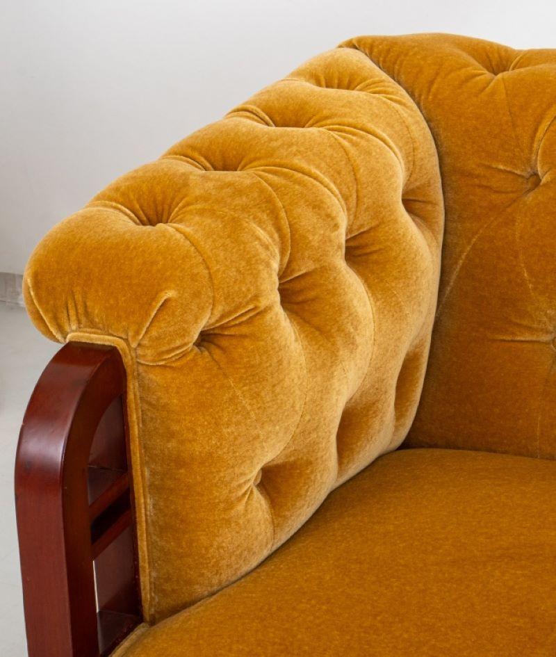 Swedish Art Nouveau Jugendstil period mohair upholstered chesterfield style mahogany settee, with buttoned back and seat with scrolling arms, the fronts with down-turned mahogany supports with horizontal support above turned legs on casters, circa