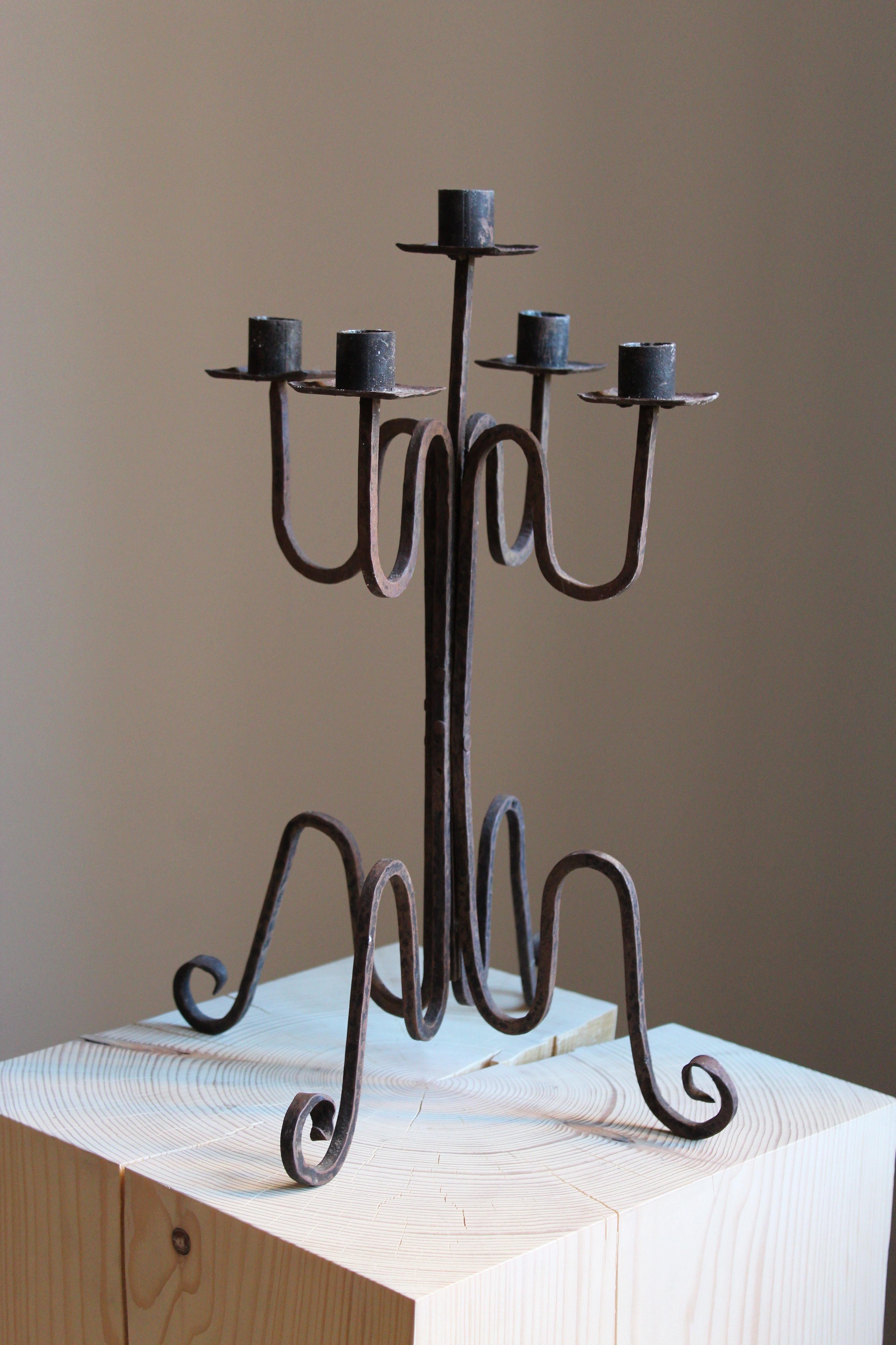A sculptural handcrafted candelabrum.

Produced in Sweden, circa 1940s.

Other designers of the period include Diego Giacometti, Lars Holmström, Josef Frank, Folke Bensow, and Line Vautrin.