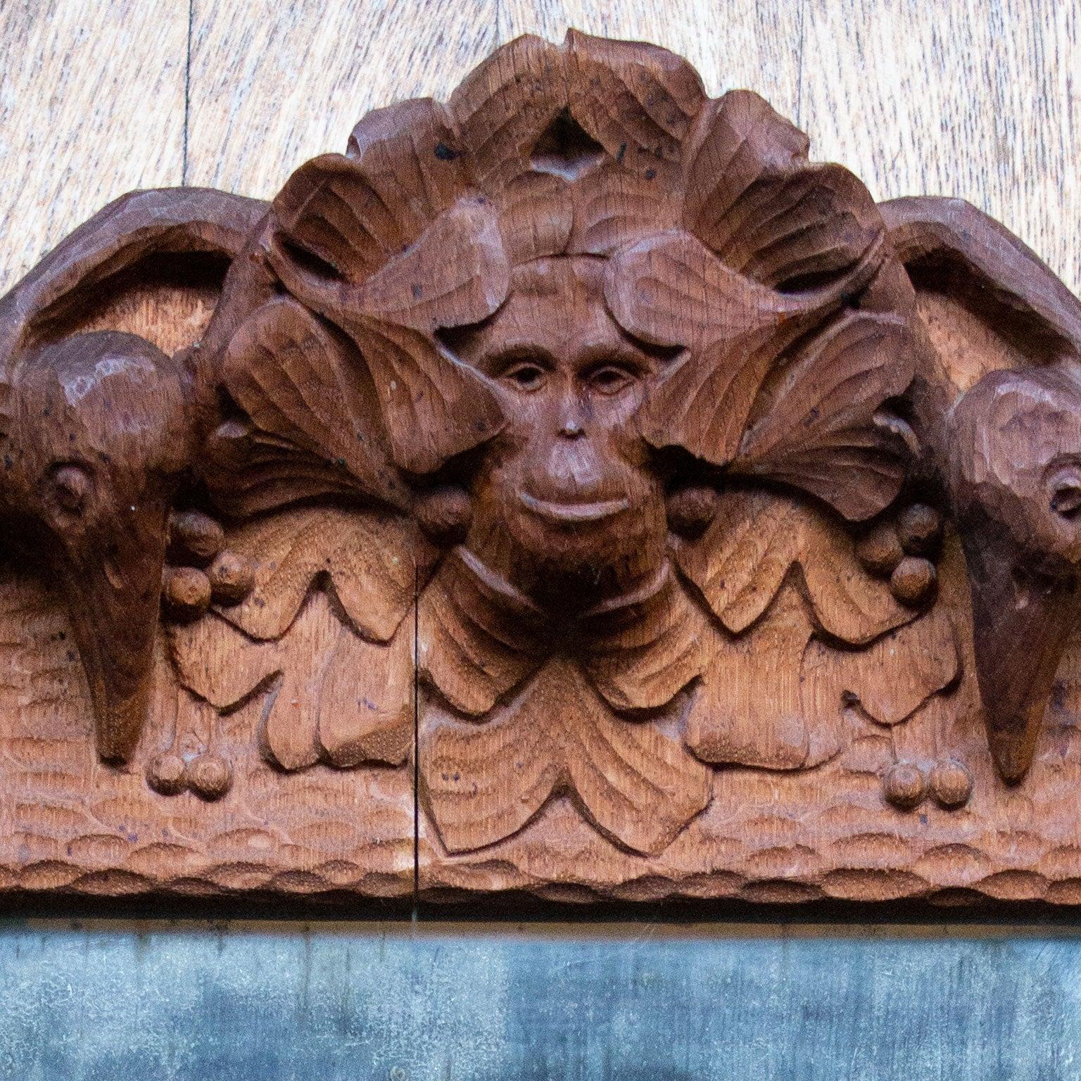 Swedish Arts & Crafts hand carved oak mirror. The entire wooden frame have a marvelous smiling monkey (baboon) in the middle holding two birds (maybe crows) in his hand.
The glass are original and has stains and patina all-over.
Apart from the