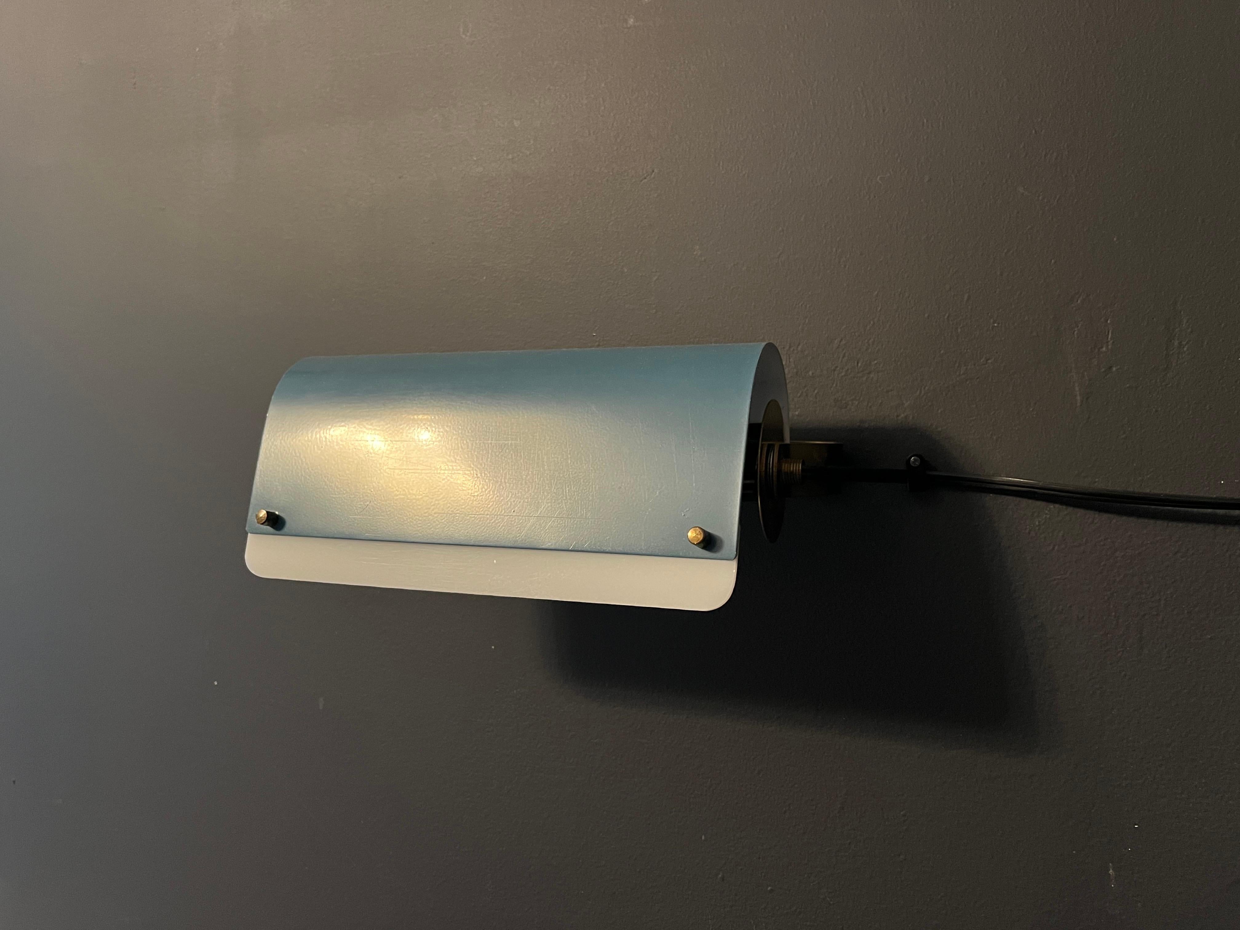 Blue metal wall light Sweden 1960 with a white acrylic partial diffuser attached with brass screws.
Rewired.