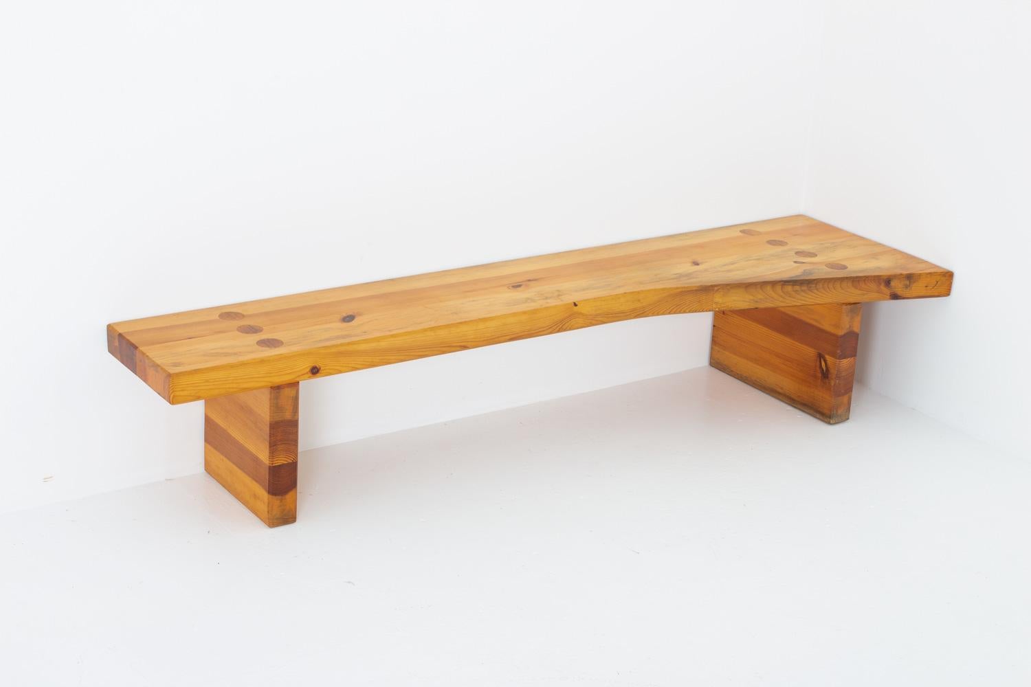 Swedish bench in thick solid pine by Sven Larsson, 1970s. 
This freeform bench was probably a special order and might be a one of a kind. The shape makes it a perfect corner piece.
Condition: Good original condition with age-related wear.