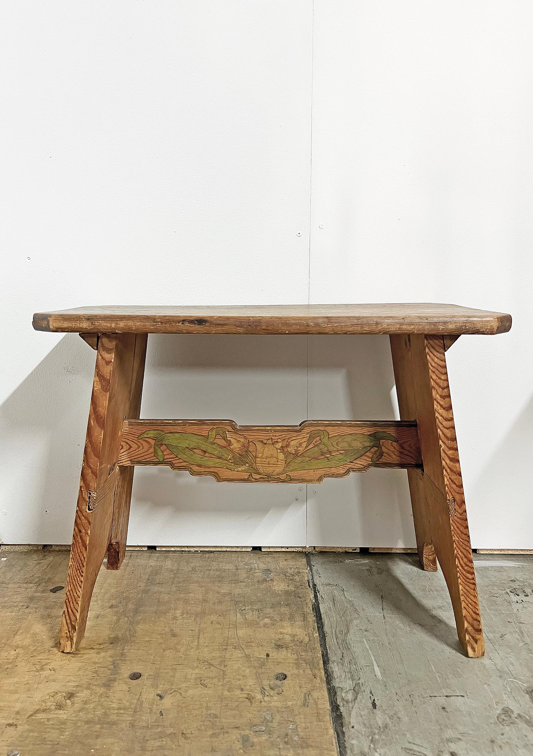 Beautiful bench in pine, Sweden, ca 1930's. 
Most likely later decor with flowers. 
Unknown creator. 
Wear and patina consistent with age and use, dry cracks, marks, scratches and stains, glue and paint residue.
Please notice that there might be