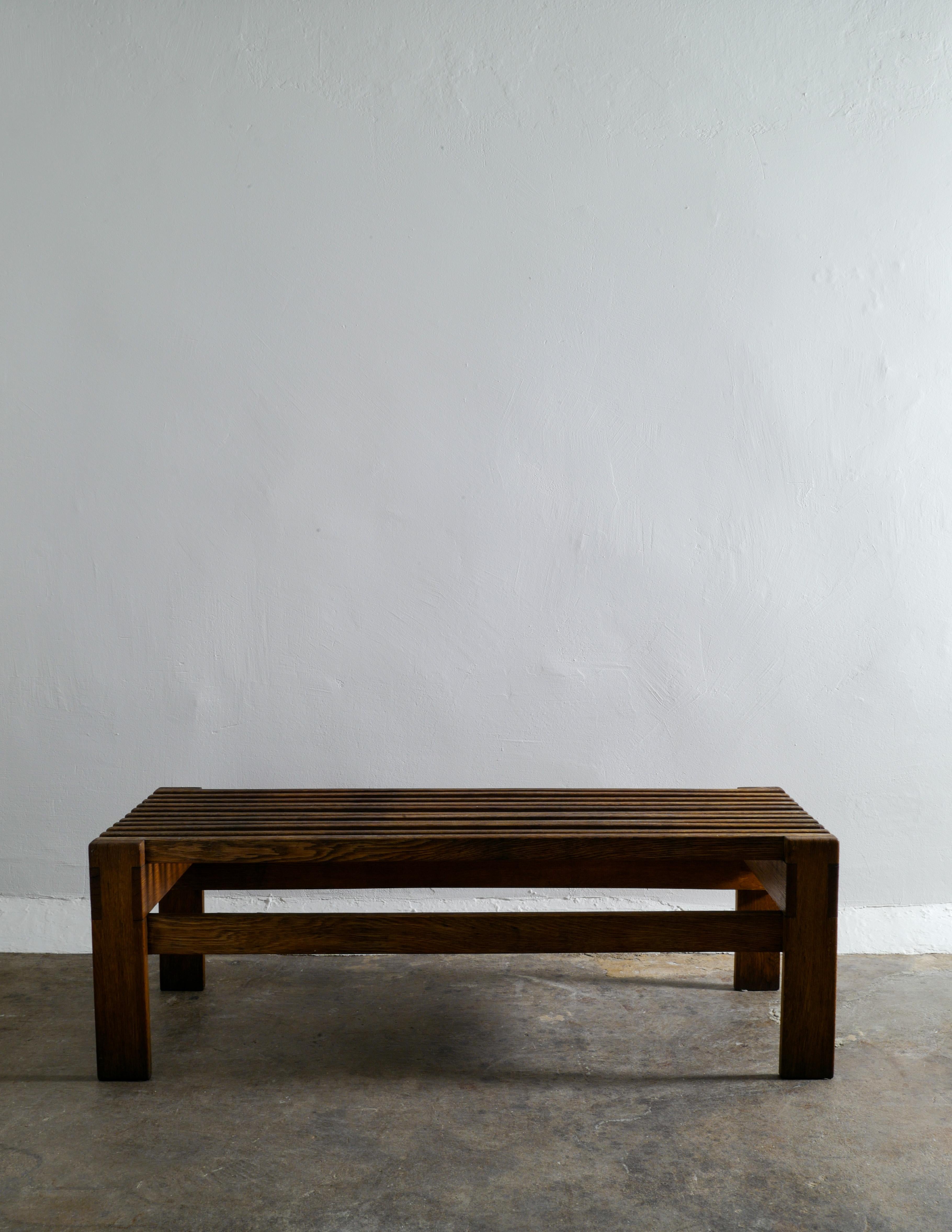 Rare Swedish bench by unknown designer in solid stained oak. In good vintage condition with some signs and patina from use.