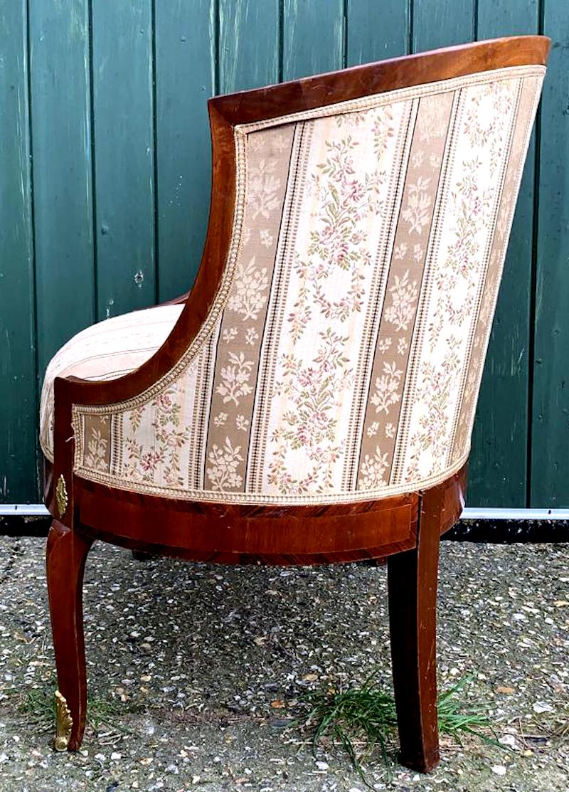 This is a rare pair of original Swedish Biedermeier armchairs with golden birch bentwood arms in a rich honey color French polish finish and with unusual delicately fluted feet and brass detailing, late 19th/early 20th century.

The extra deep