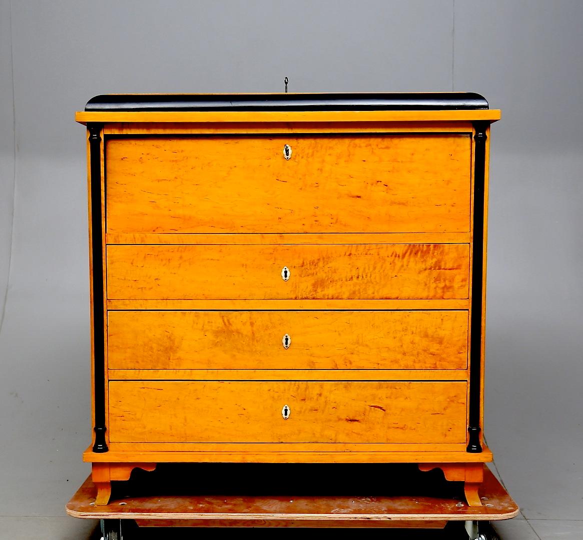 Rare Swedish Biedermeier chest of drawers writing desk chiffonier in top grade golden birch veneers in good structural condition, circa mid-1800s in age.

3 drawers and drop down writing table with 12 mini drawers behind with bone style