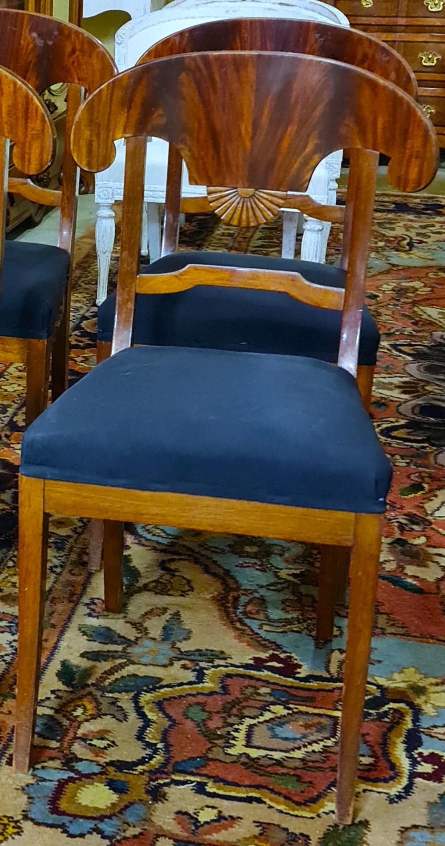 Unusual set of 4 1800s Swedish Biedermeier dining chairs in good structural condition with Fine carved detailing. The set is 4 dining chairs and there are also 2 carver chairs available separately . Lovely Classic legs and detail on the centres.