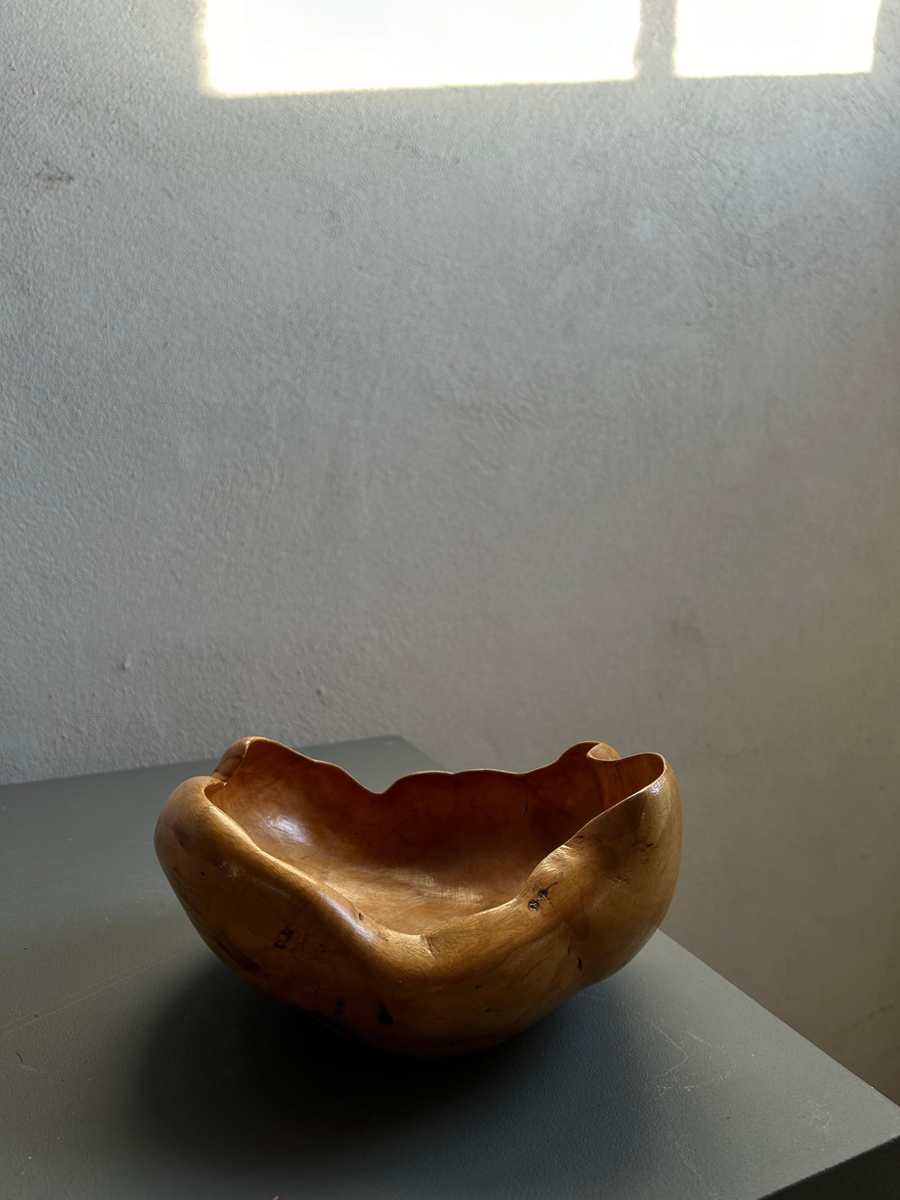 This stunning organic-shaped bowl, crafted from birch root, is a beautiful example of Scandinavian craftsmanship. Created by an unknown Swedish artist, it is signed “H. Ingemarsson 1978,” adding a personal touch to its already remarkable presence.