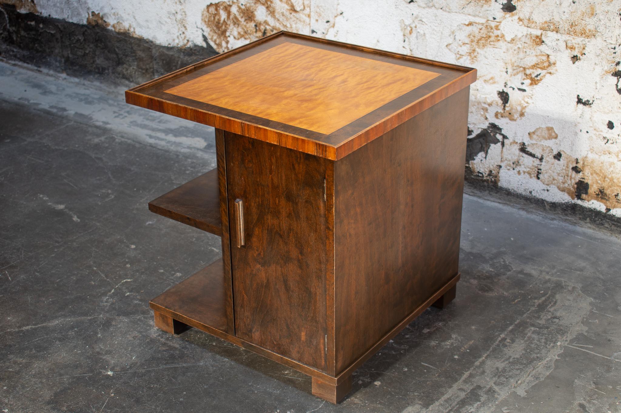 Handsome Art Deco Smoking Table in Swedish Birch with rosewood and elm Intarsia inlaid top. Perfect as a side table in an area that could also use additional storage and could also work as a low bedside table. This piece has an open shelf on one