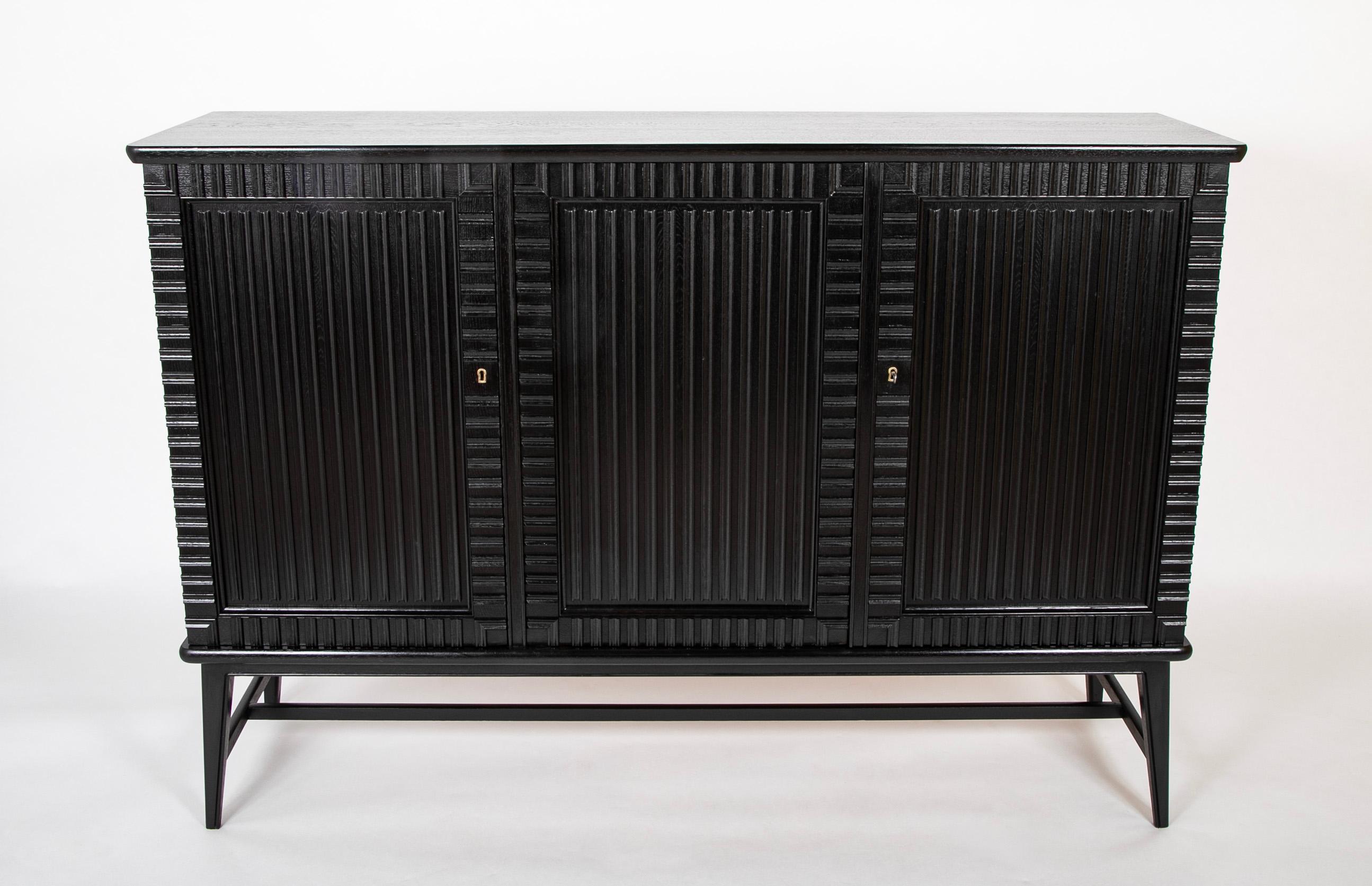 Black lacquer three door cabinet attributed to Oscar Nilsson ( Sweden. 1895 - 1975 ) with 