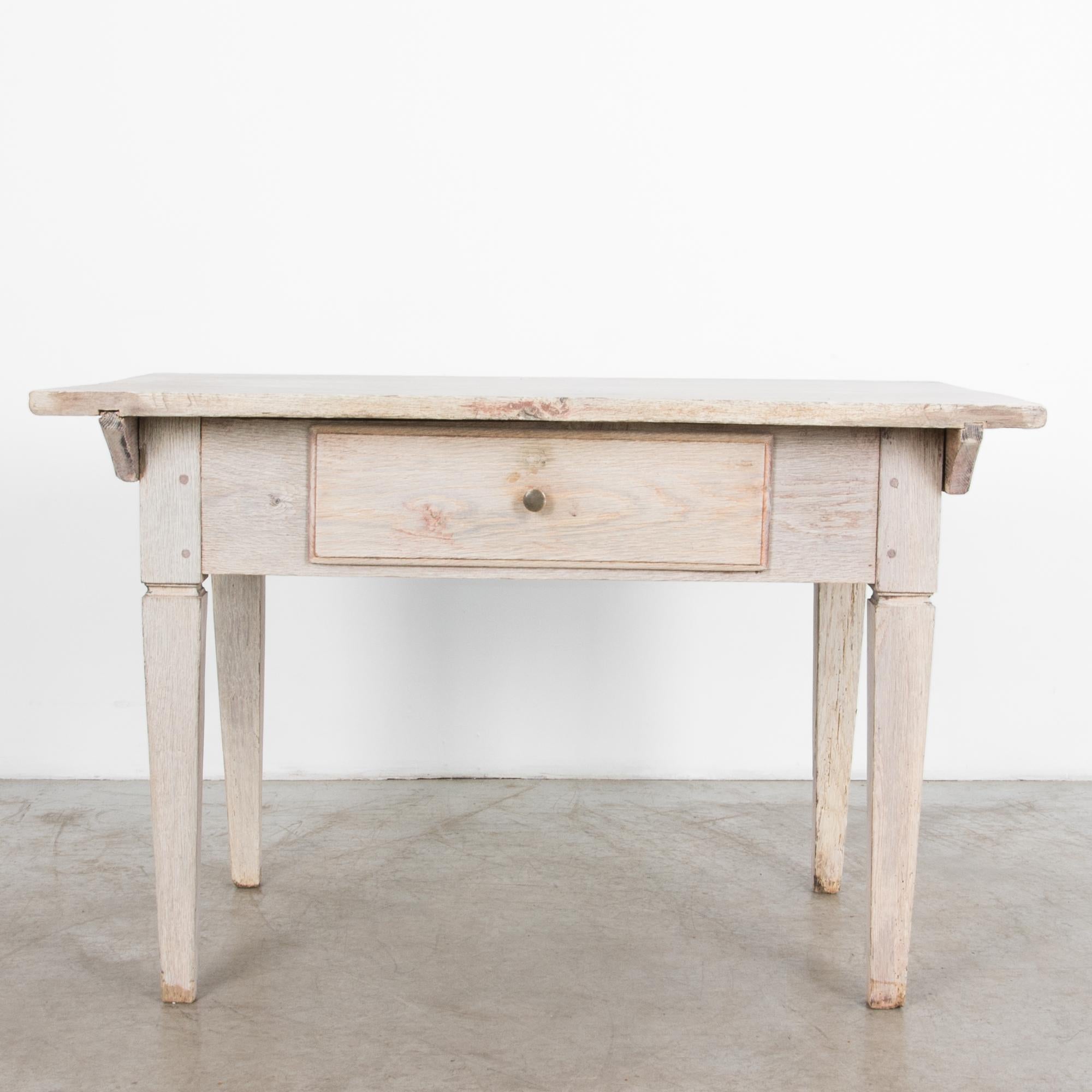 An oak side table with drawer from Sweden, circa 1880. In Gustavian fashion
this piece features the crisp lines and simple forms famous in Scandinavian furniture, with a subtle elegance, a nuanced sense of balance and style in a simple and
