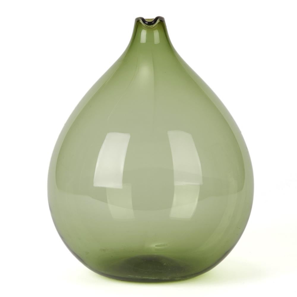 A large and stylish Blomkulla Swedish Art Glass vase designed in green glass by Kjell Blomberg for Gullaskruf. The large rounded bottle shaped vase has a small sparrow beak shaped top with a slightly recessed rounded foot. The vase is not marked.