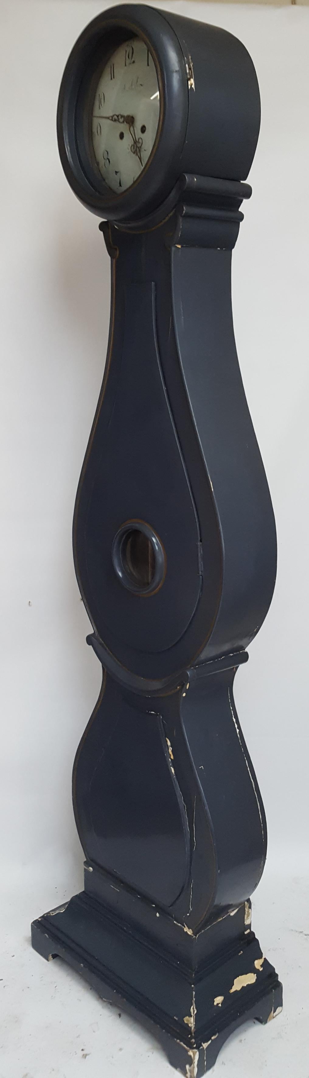 Antique Swedish Mora clock from early 1800s in probable original paint with a great fryksdall shape body and a good face with lots of detail and unusually deep set back face. It has the classic swag motifs and extended belly of a traditional Swedish