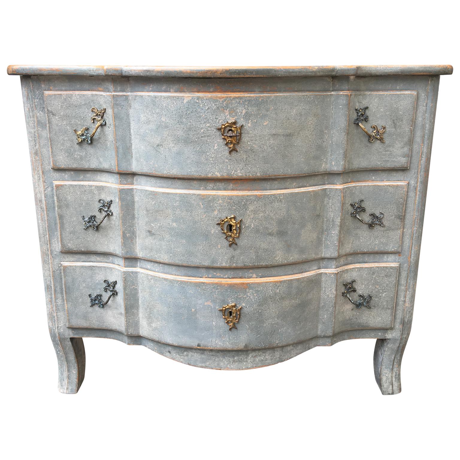 Swedish blue painted 19th century chest of drawers

Swedish blue painted 19th century chest with 3 drawers and original brass hardware. 
Key included, lock in good working condition.

Please note that this chest of drawers is located in Halmstad