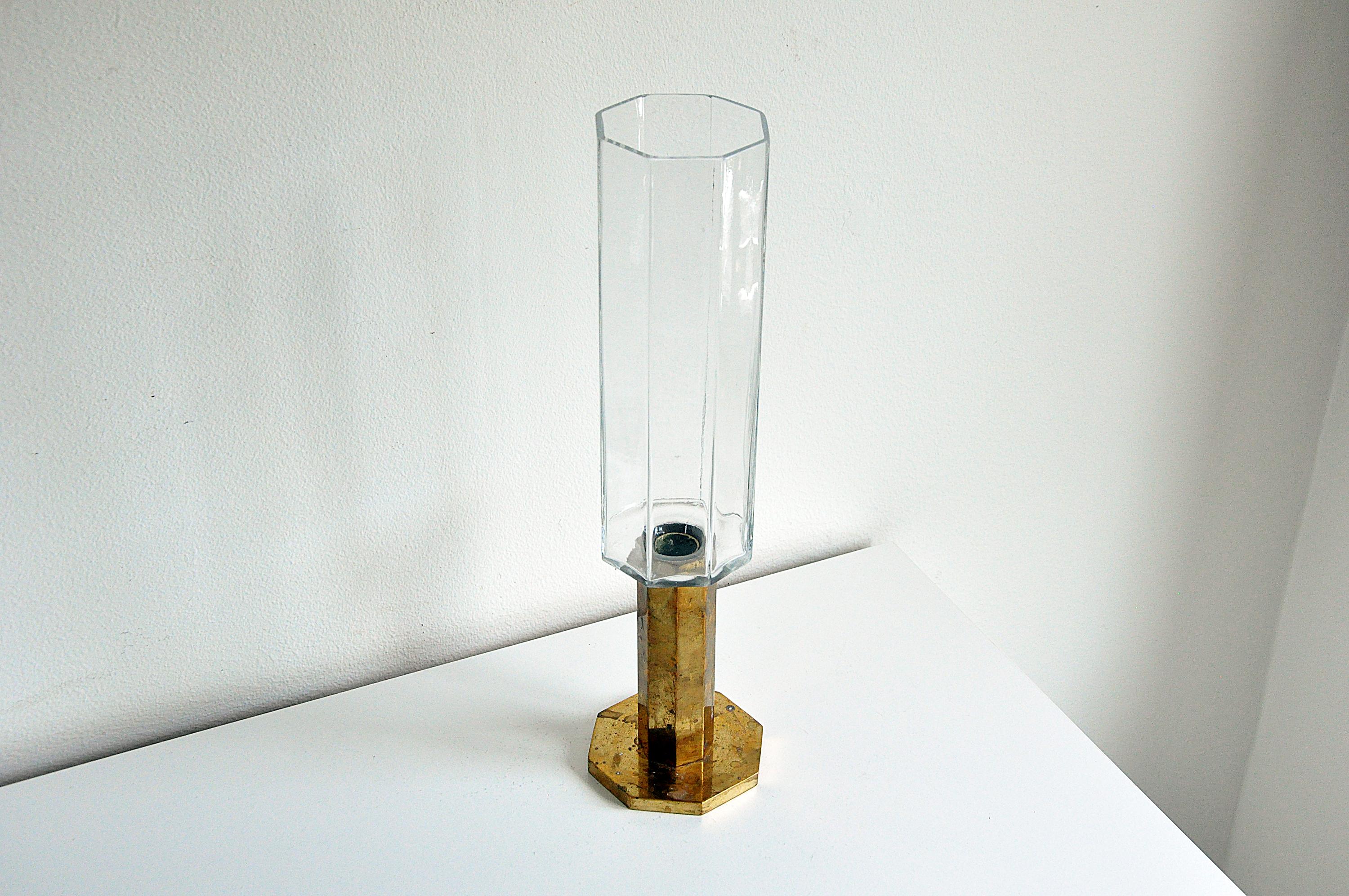 Swedish candleholder in brass and glass from Metallslöjden Gusum, 1987.
Brass patina. 
Signed with makers mark.