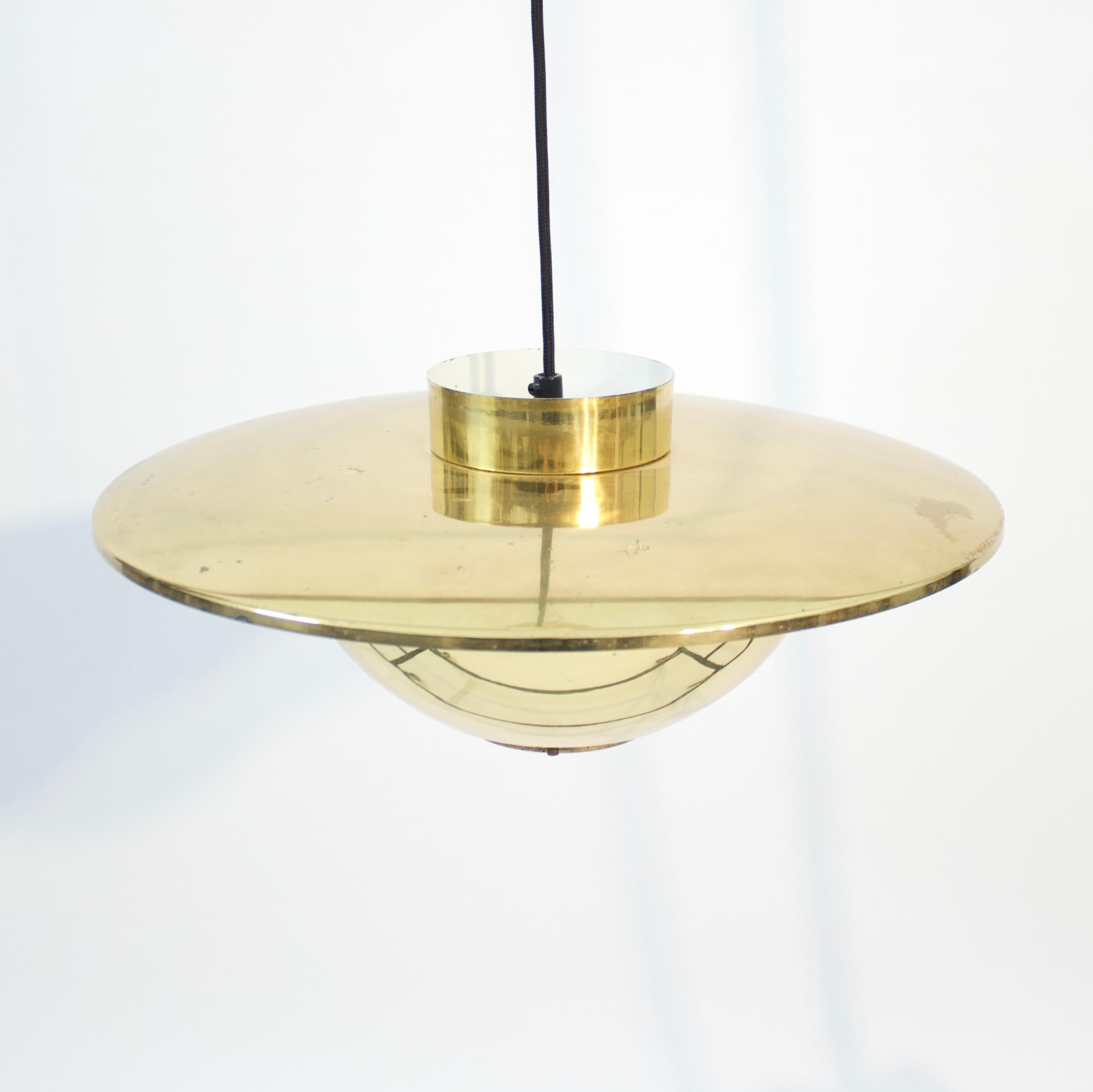 Brass ceiling lamp, attributed to Boréns or Bergboms (there have been claims that both of these firms did produce this model) and produced in Sweden in the 1960s. It has kind of a saucer shape and is very typical of the 60s design that were