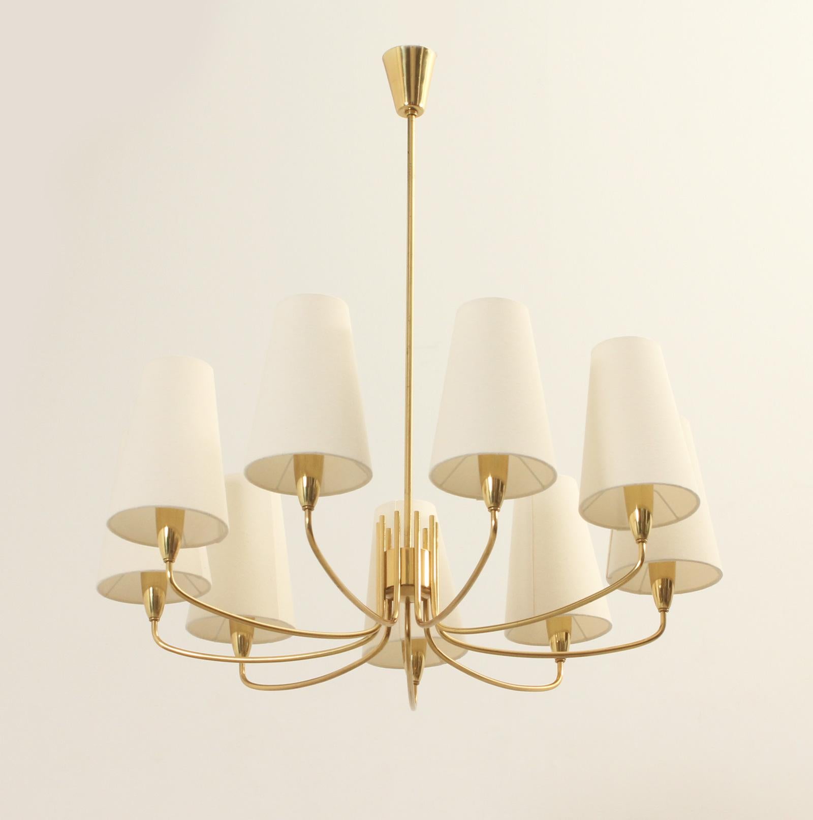 Brass chandelier with nine arms, Sweden, 1940's. Brass and nine shades with new fabric. 