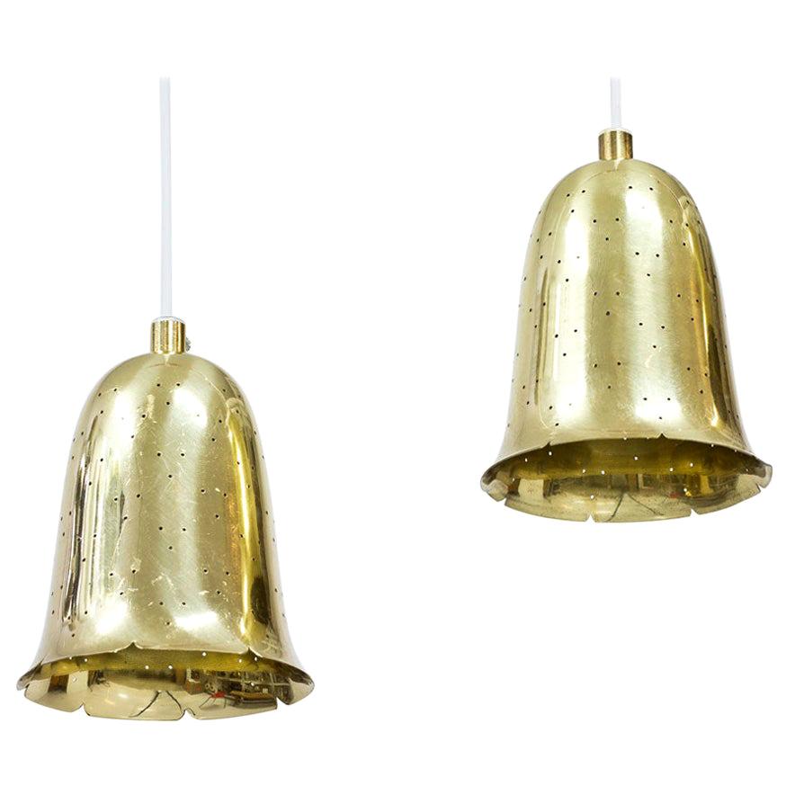 Brass bell shaped pendant lamps produced by Boréns at Borås in Sweden during the 1950s. 
Lamps made out of perforated polished solid brass. New electricity.
