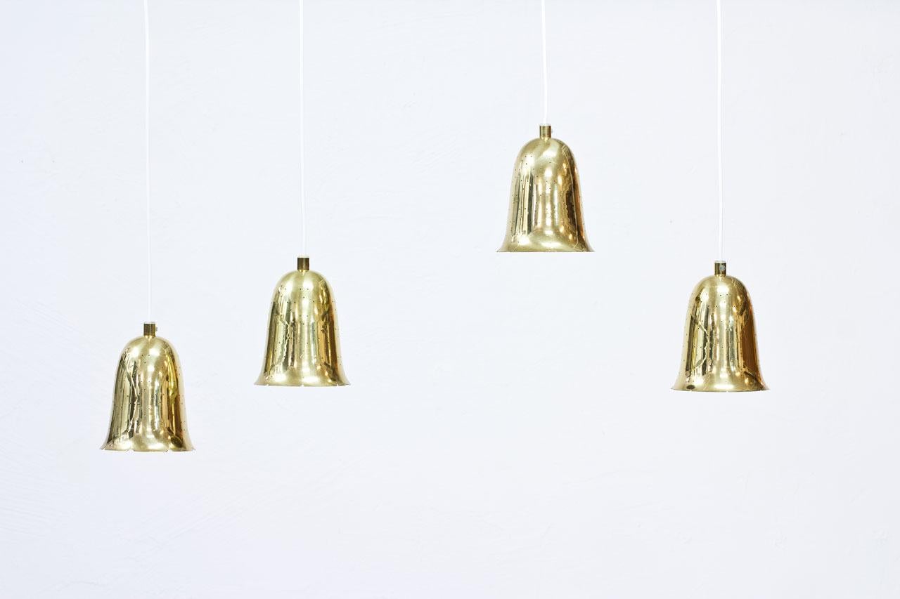 Brass bell shaped pendant lamps produced by Boréns at Borås in Sweden during the 1950s. Lamps made out of perforated polished solid brass. New electricity.