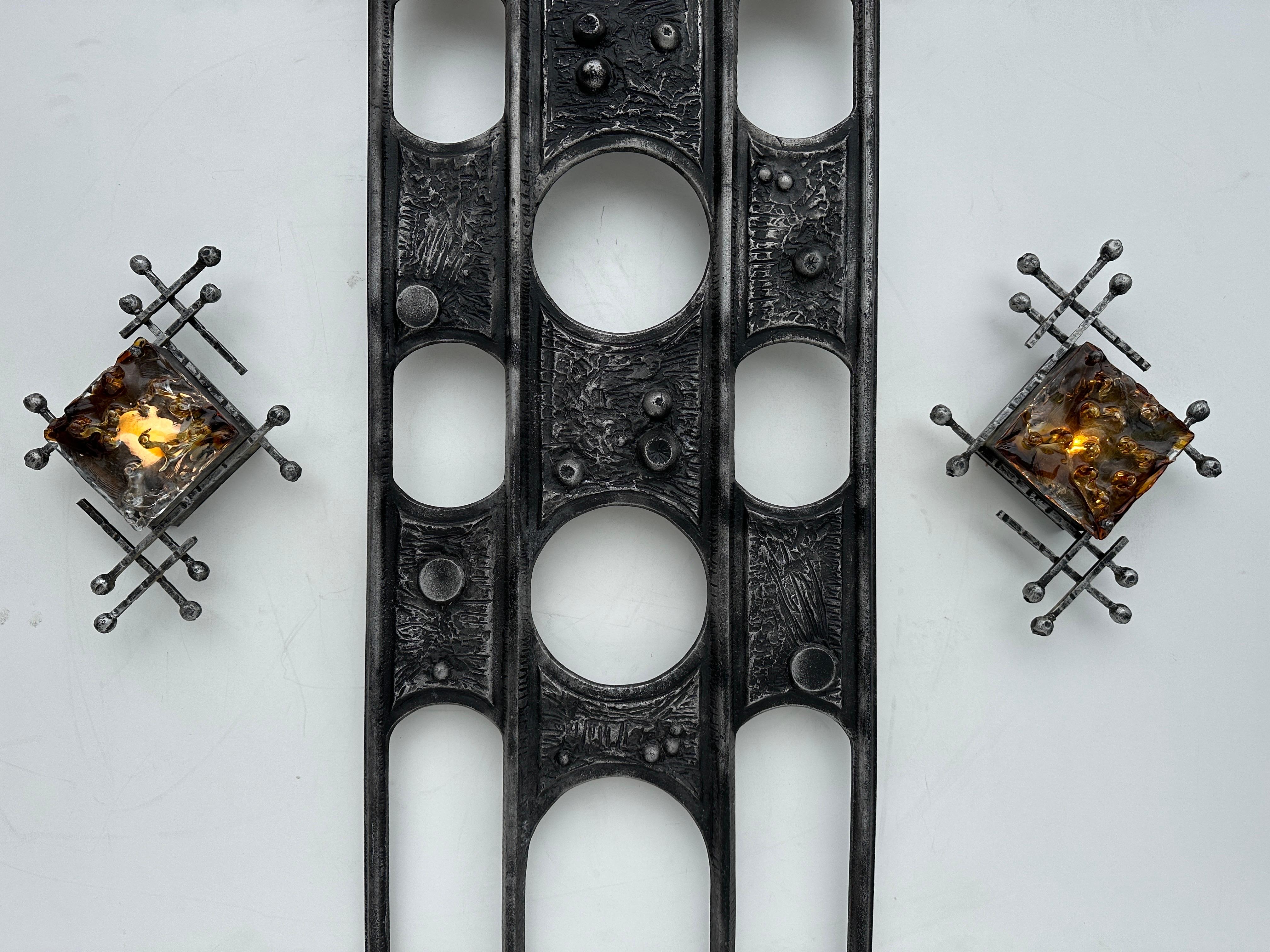Swedish Brutalist cast aluminum and cast glass wall sconces by Tom Ahlstrom and Hans Ehrlich. Total five available and priced individually. These are mostly for mood lighting not to brighten up the entire room.