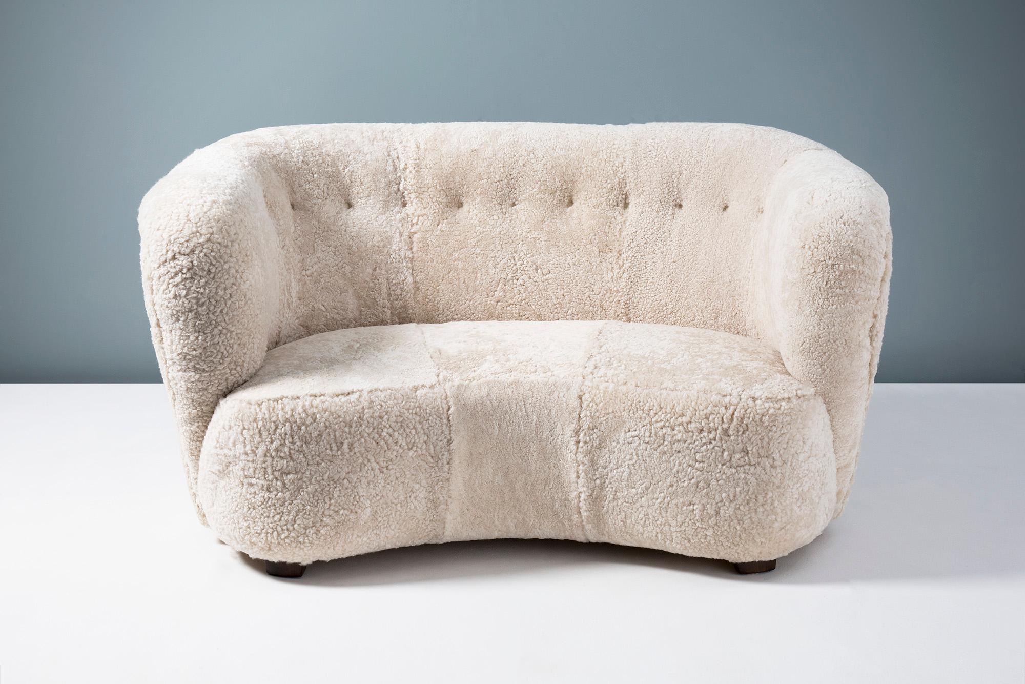 Swedish cabinetmaker 1950s Sheepskin loveseat sofa

This small love seat sofa was produced in Sweden in the 1940s. It has been reupholstered in luxurious Australian shearling at our workshops in London. The legs are made from stained beechwood.