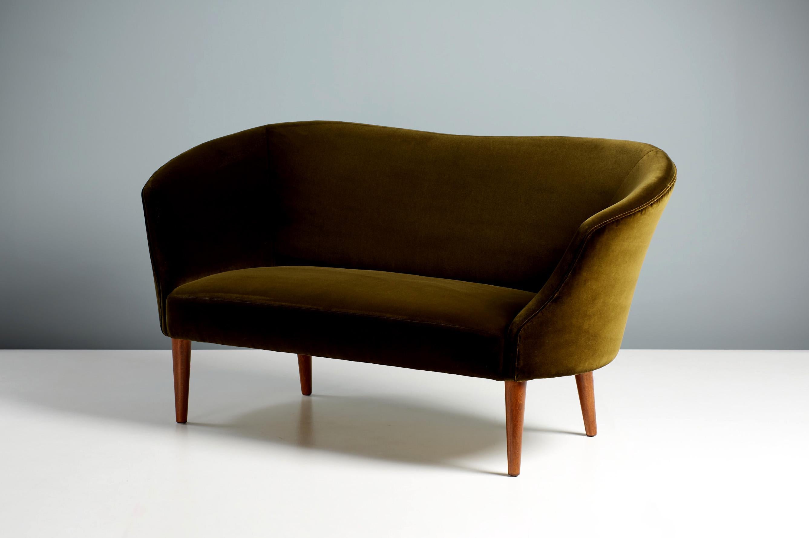 Swedish cabinetmaker 

Love Seat Sofa, 1950s

Curved, art-deco style sofa produced in Sweden c1950s by an unknown cabinetmaker. The legs are stained beech wood and the sofa has been reupholstered in exquisite, moss-green cotton velvet