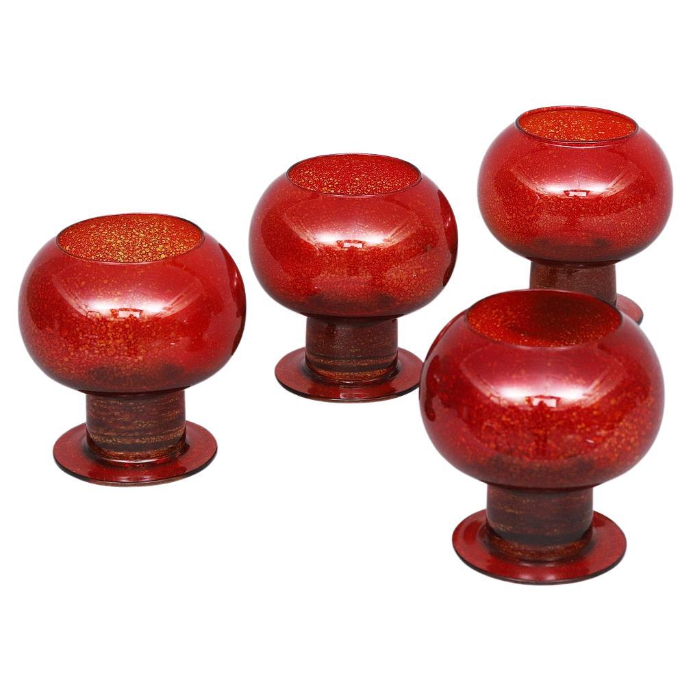 Swedish candelabra holders, in a red blown glass, early 20th century 