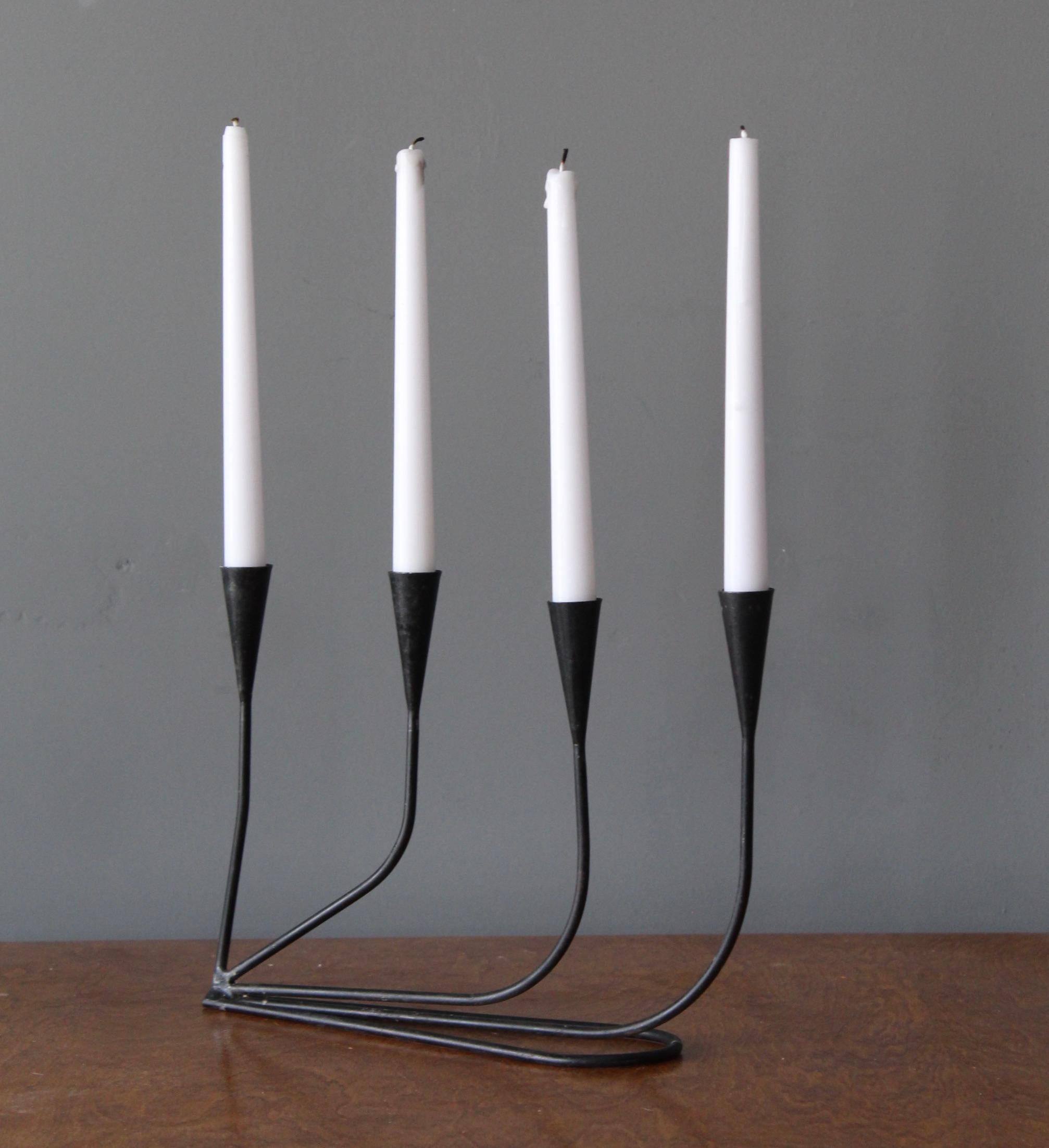 A four-armed candelabra. Made in Sweden, c. 1940s-1950s.