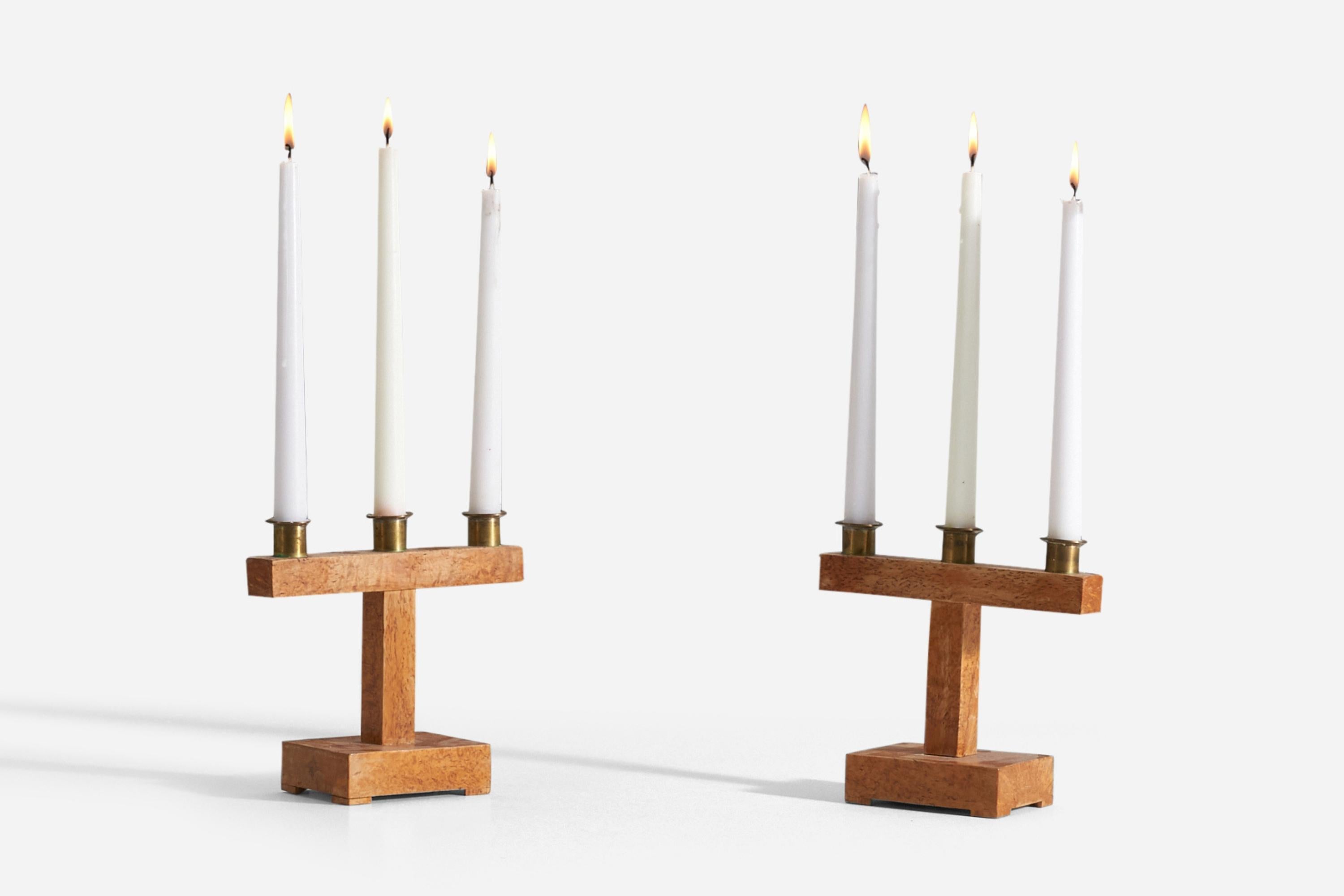 A pair of sculptural / Minimalist candlesticks. Designed and produced in Sweden, 1930s. The simplicity of the form enhances the beauty of the masur birch. Signed 