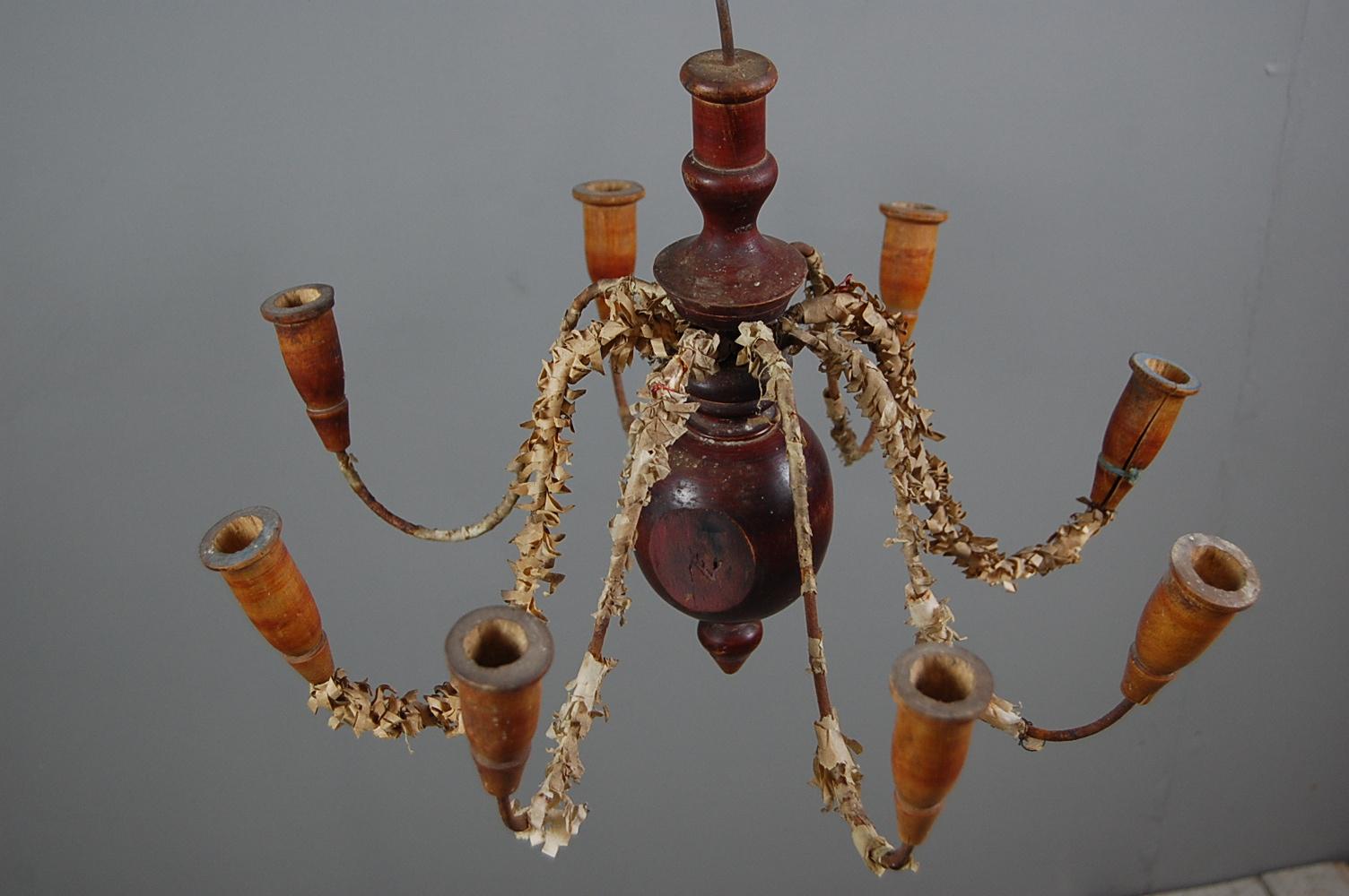 Southern Swedish chandelier, painted turned wood and iron. The fine and delicate nature of this example lead us to believe this originates from Southern Sweden. The iron arms have tissue paper decoration, which could easily be removed if required.