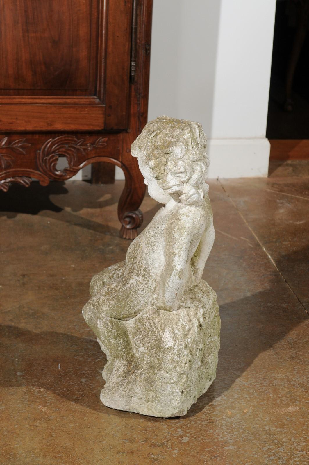 Swedish Carved Stone Garden Sculpture of a Putto Sitting on a Rock, 20th Century For Sale 4