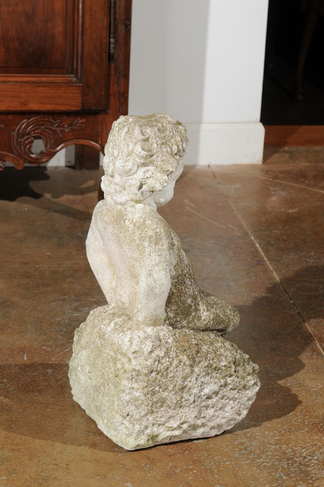 Swedish Carved Stone Garden Sculpture of a Putto Sitting on a Rock, 20th Century For Sale 6
