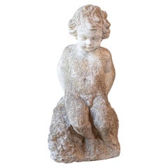 Swedish Carved Stone Garden Sculpture of a Putto Sitting on a Rock, 20th Century