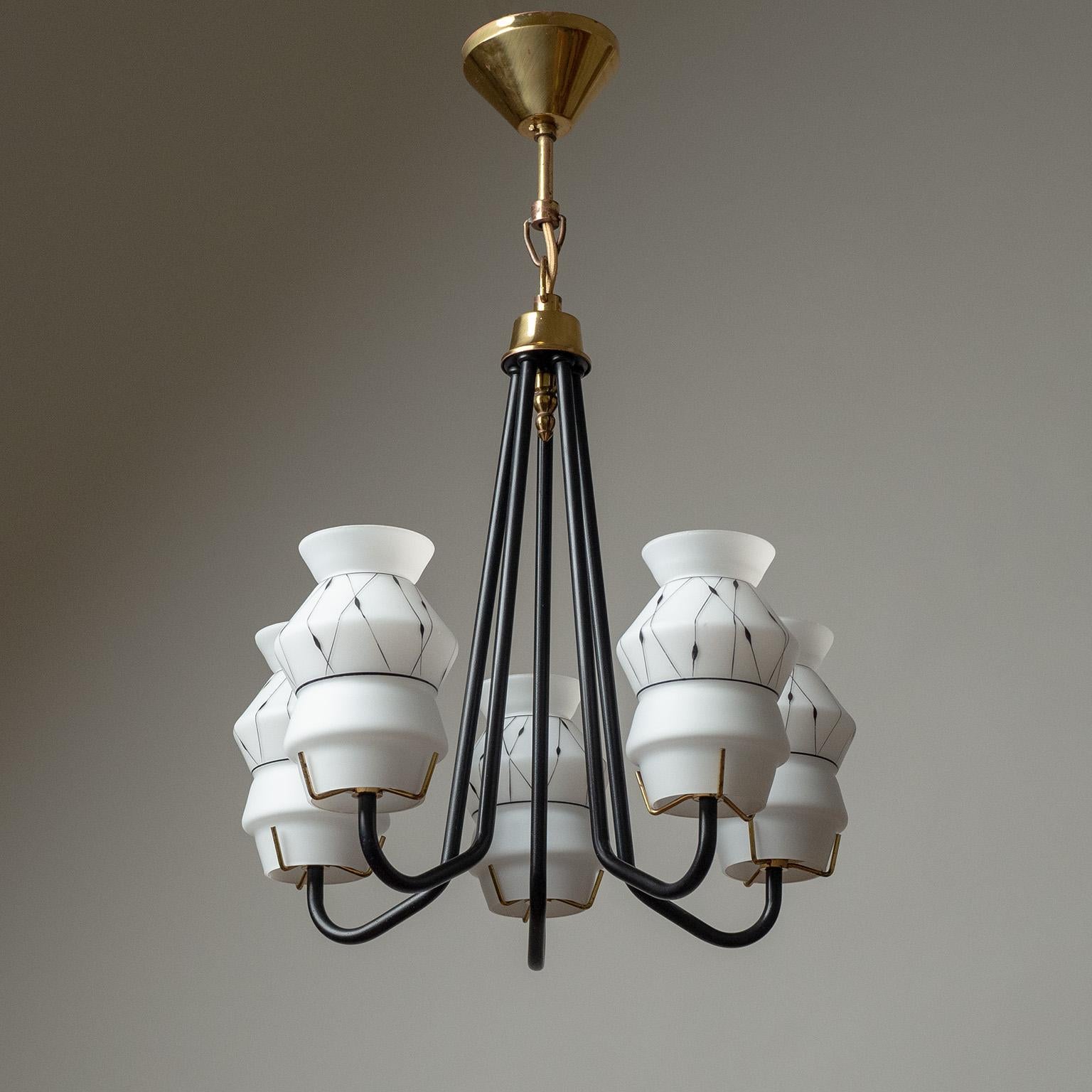 Charming Swedish ceiling light from the 1950s in classic colors of black, gold and white. Five black lacquered arms, each with an enameled glass diffuser held by brass details. Very nice original condition with minimal patina. Five original E27