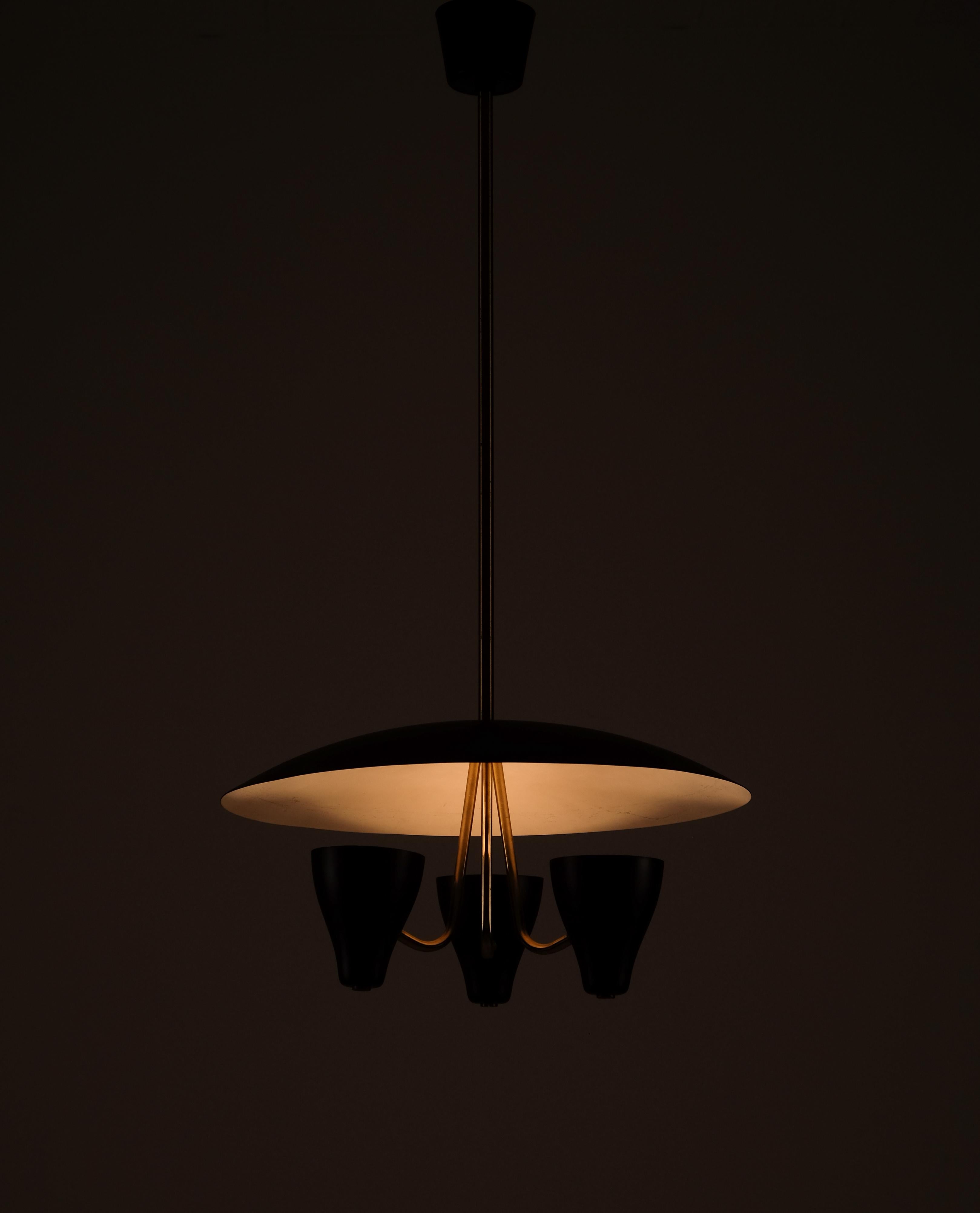 Swedish ceiling light with black lacquered metal shade and brass details.
Diameter: 45 cm