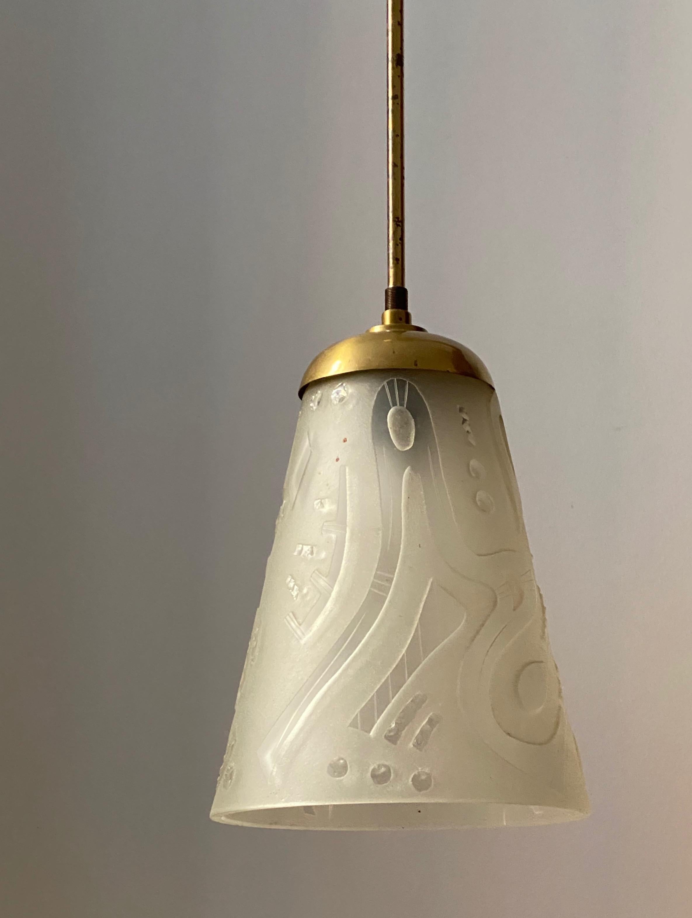 A pendant light. Designed and produced in Sweden, c. 1940s-1950s. Features cut and frosted glass and brass.

Other designers of the period include Hans Bergström, Paavo Tynell, Hans Agne Jakobsson, and Lisa Johansson-Pape.