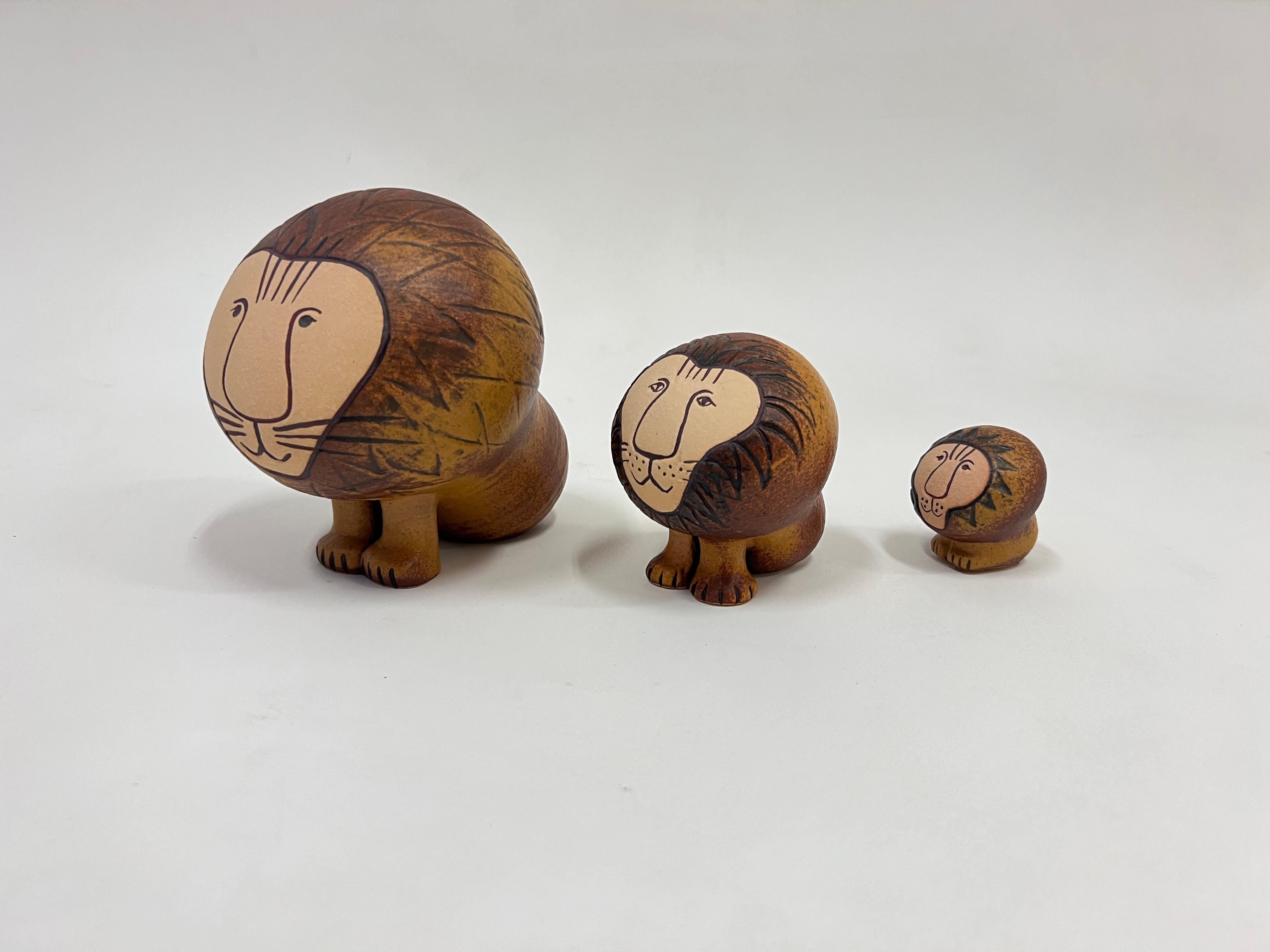 Cute family of three Swedish ceramic lions by renowned ceramicist Lisa Larson. 

Constructed of glazed ceramic. All are marked made in Sweden and Lisa L. 

Dim: 
L-5.5” High, 5” Wide, 7” Deep.
M-4” High, 3.5” Wide, 3.5” Deep. 
S-2.25” High, 2” Wide,