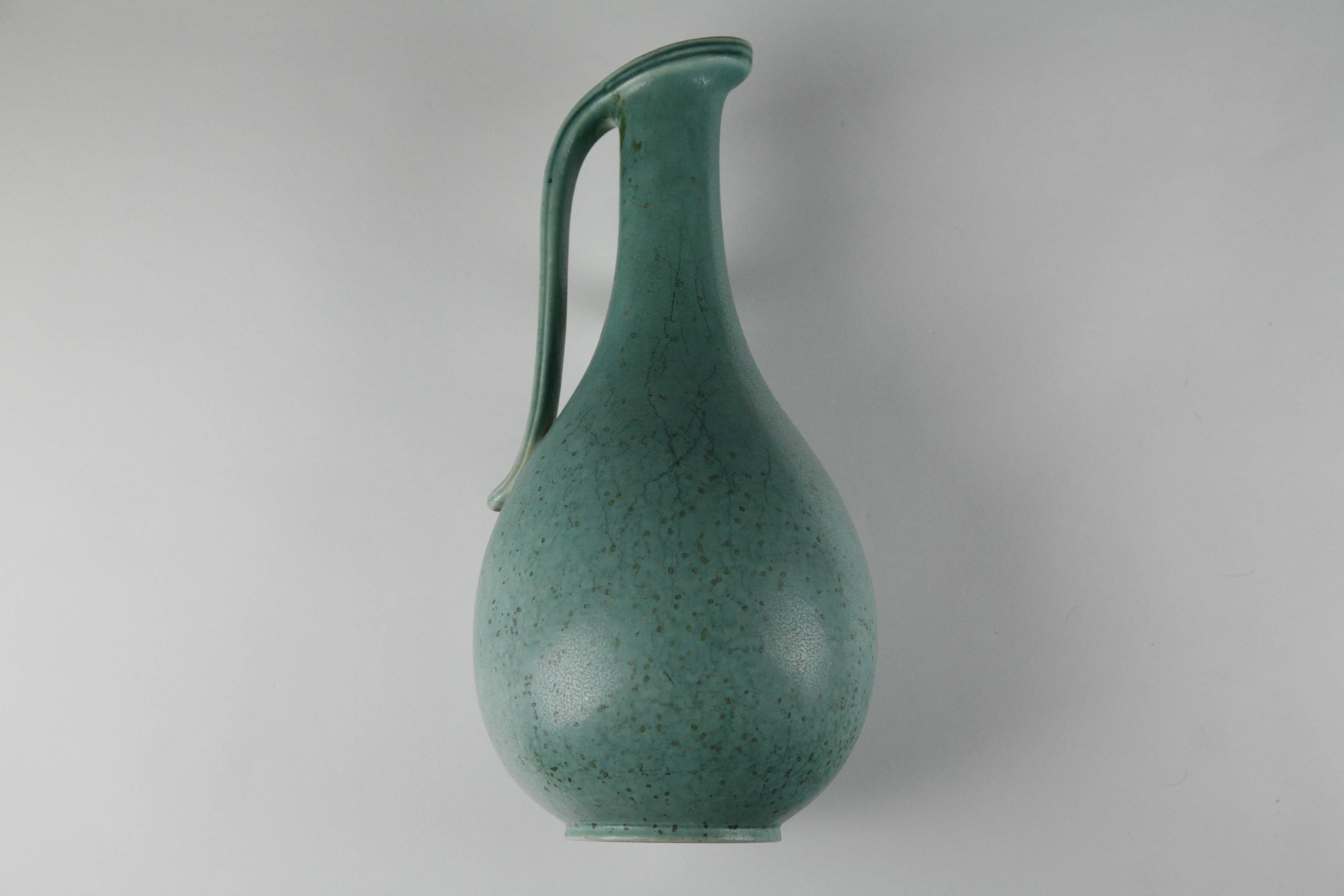 Sweden, 1950s ceramic vase by Gunnar Nylund, for Rörstrand in quartz green excellent condition and signed on the bottom.