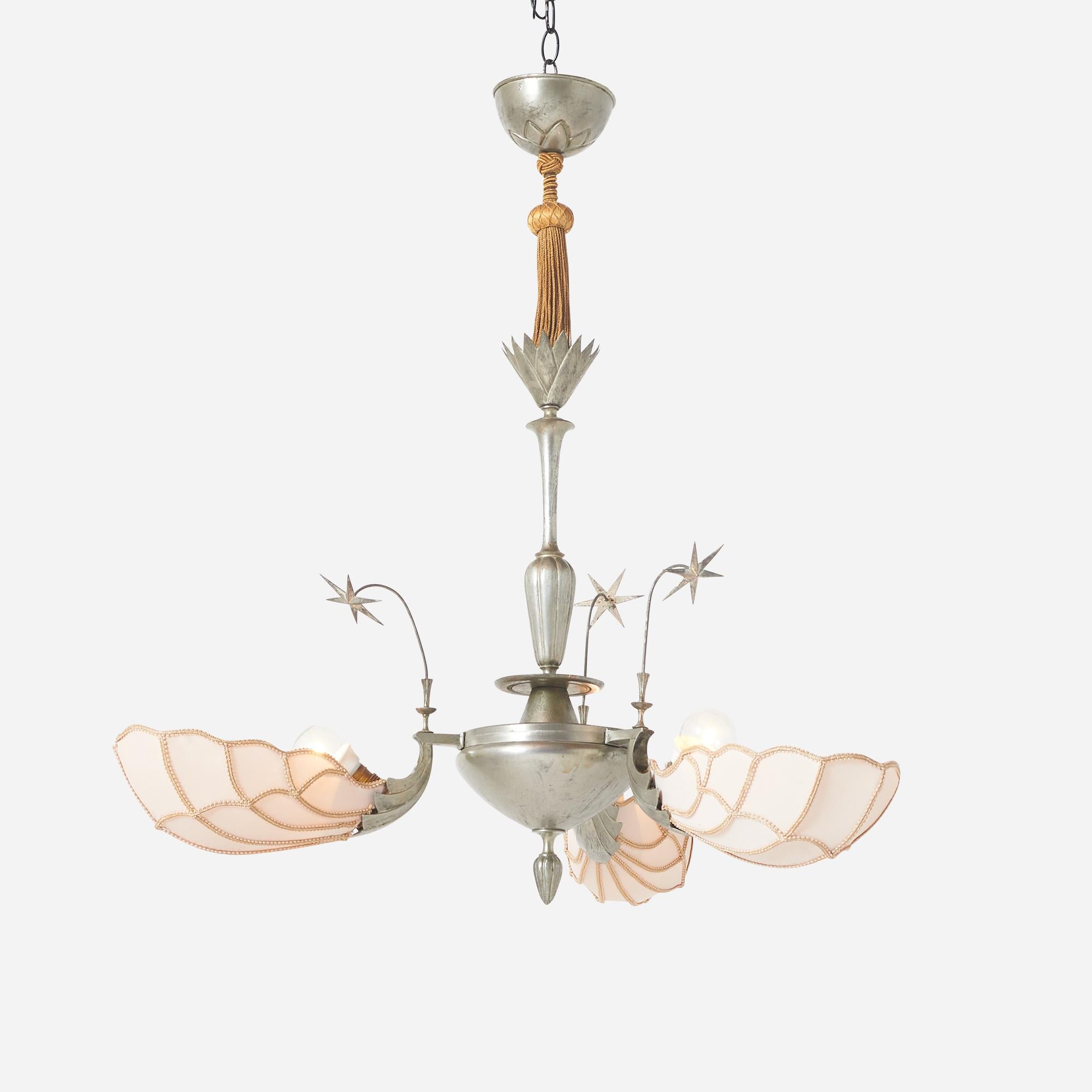 A Deco Chandelier of pewter and fabric - decorated with tassels and stars. Designed by an unknown creator.
