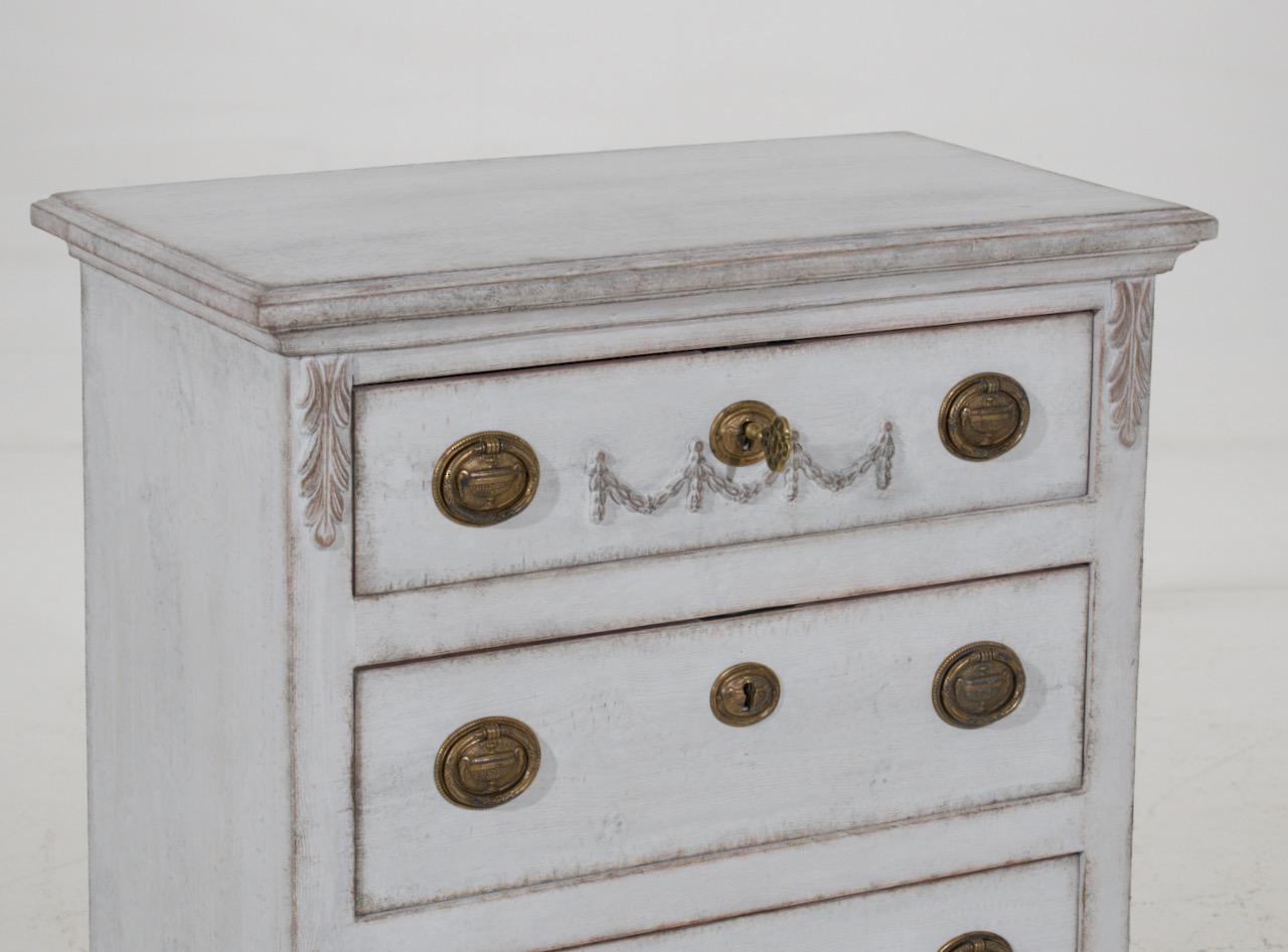 Small Swedish chest with three drawers and ornaments, original hardware and key, circa 100 years old.