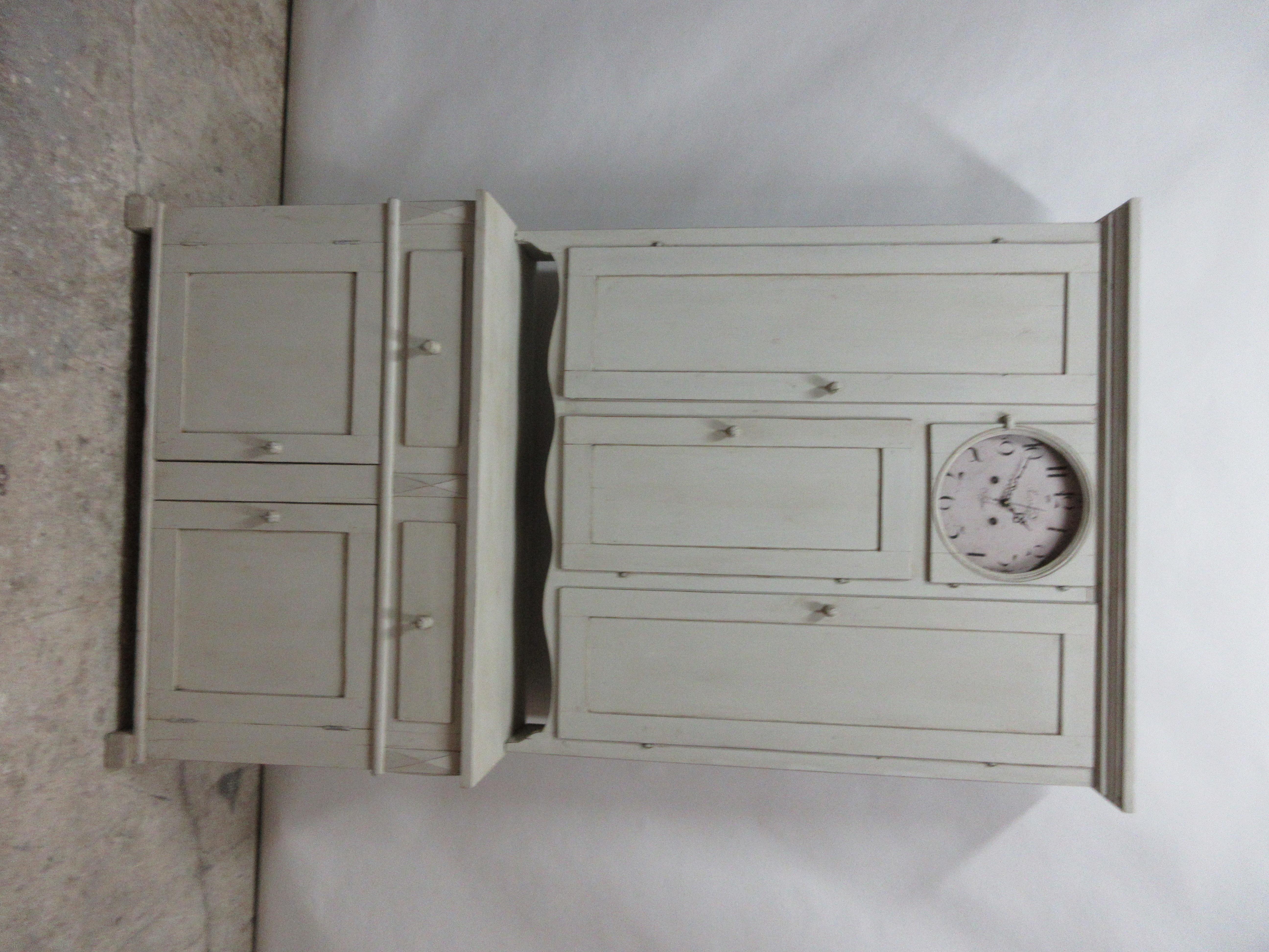 This is a Swedish clock cabinet , it has been restored and repainted with milk paints 