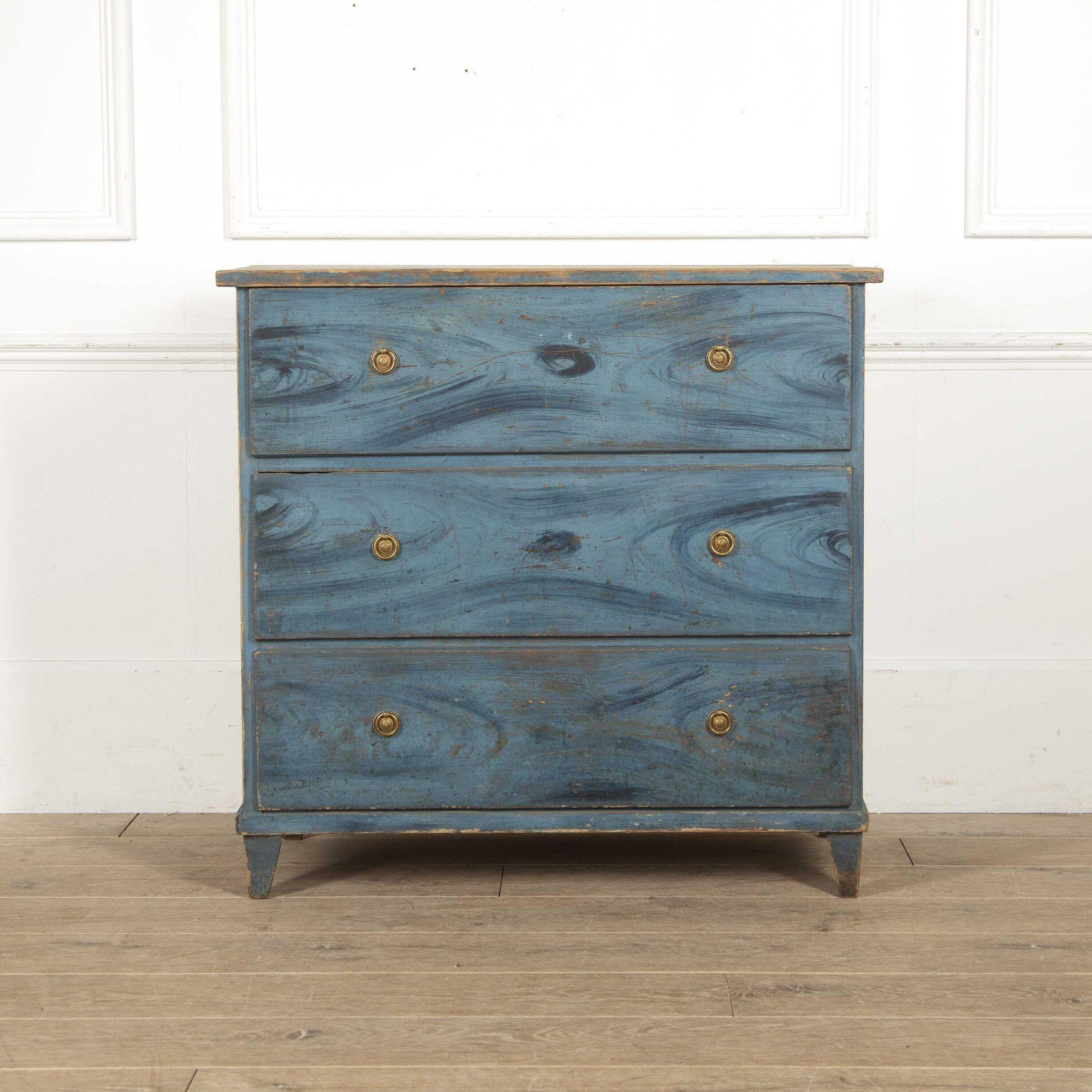 Stunning Swedish three-drawer commode.
This commode is in its lovely original two-tone blue paint that highlights its striking patina.
The top drawer has three secret drawers inside that are wonderfully spacious and are mounted with lovely brass