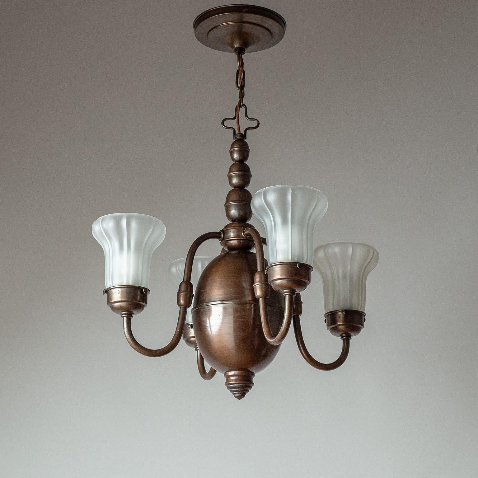 Lovely Swedish Art Deco copper chandelier with satin glass diffusers from the 1930s. Bulbous body in patinated copper with delicate floral-shaped glass ‚tulips‘, which are acid-etched for a satin finish. Four original brass and ceramic E27 sockets