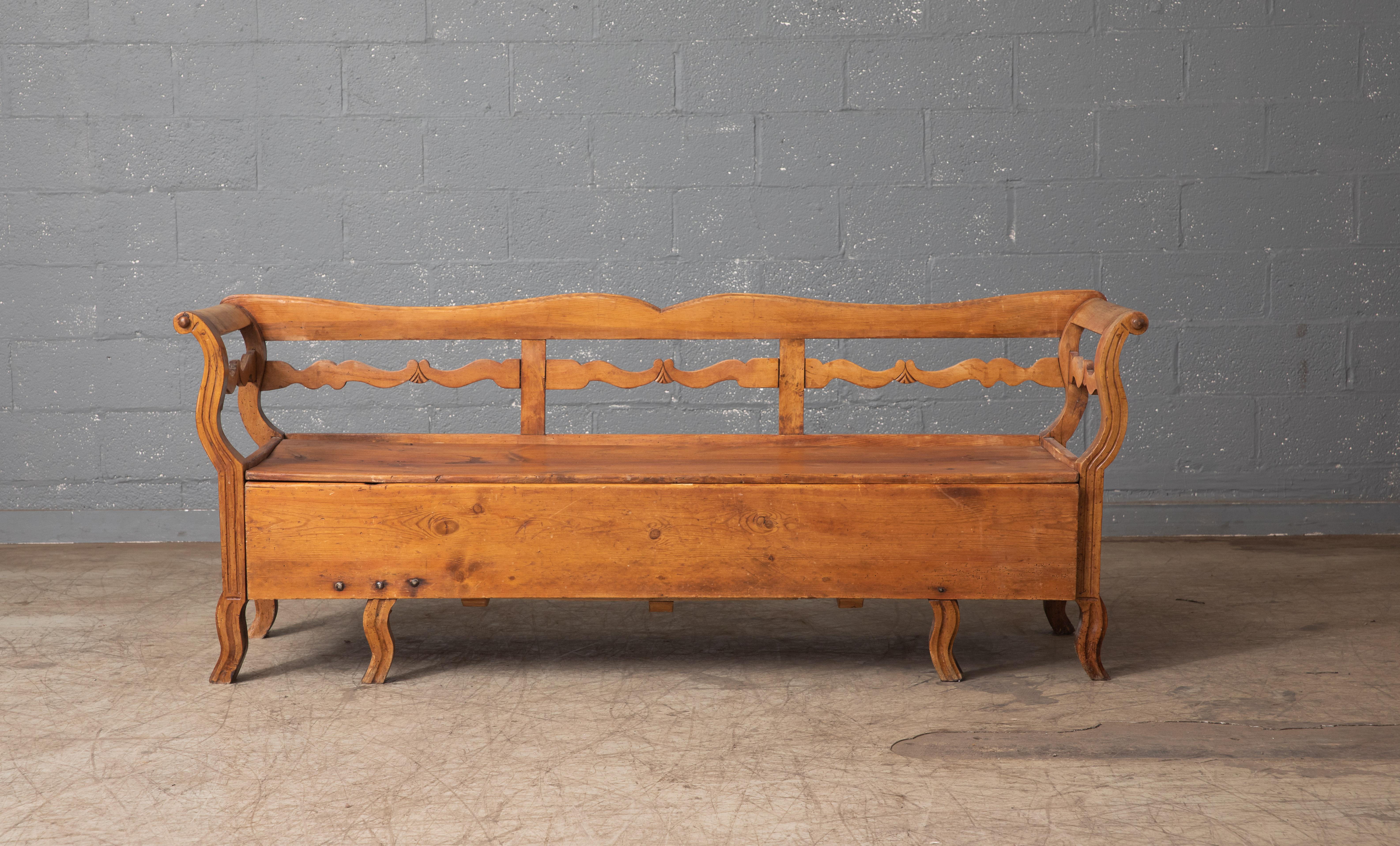 Traditional Swedish bench with storage. These type of benches were typically made and used on farms in mid- to late 19th century. The storage inside the bench was typically filled with straw and blankets and people would sleep in them. They were