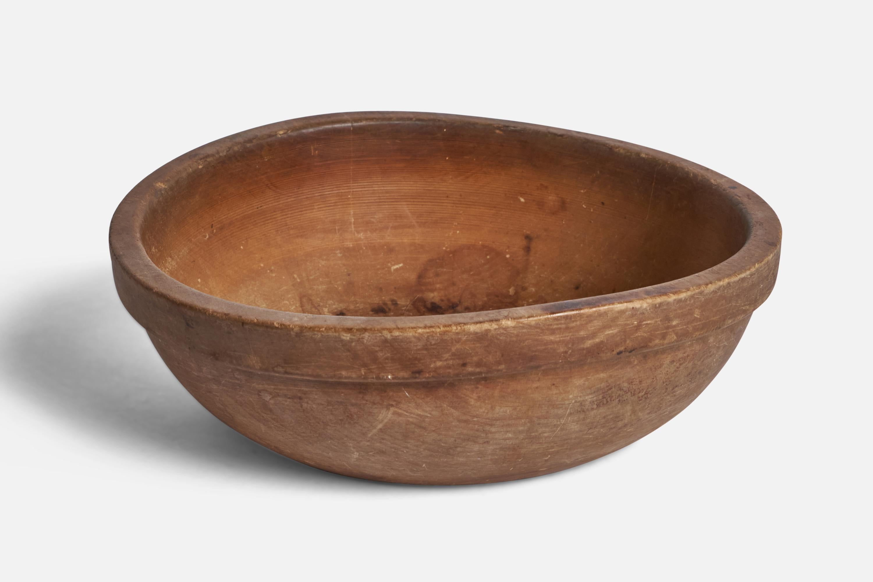 A wood bowl designed and produced in Sweden, 19th century.